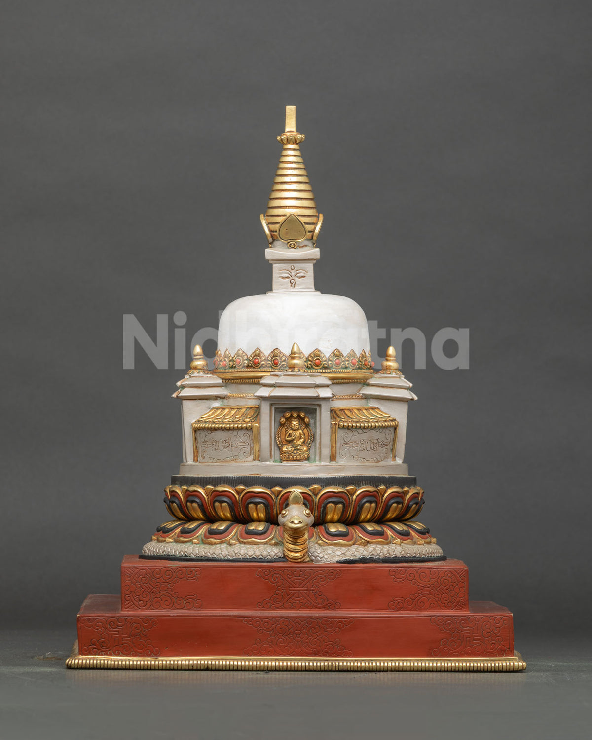 Hand-painted Buddhist chorten stupa with gold-gilded copper spire and serpent protector, front view