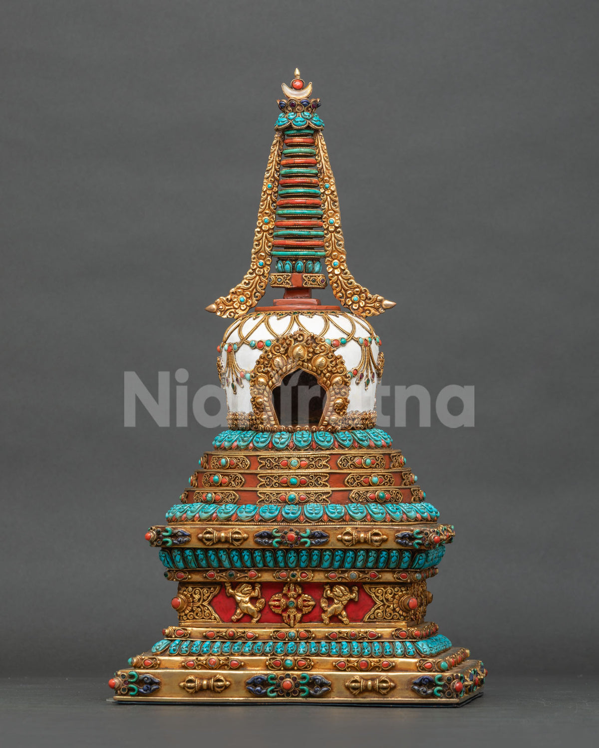 Hand-painted copper Tibetan stupa with gold-gilded repoussé and turquoise coral gemstone inlay, front view