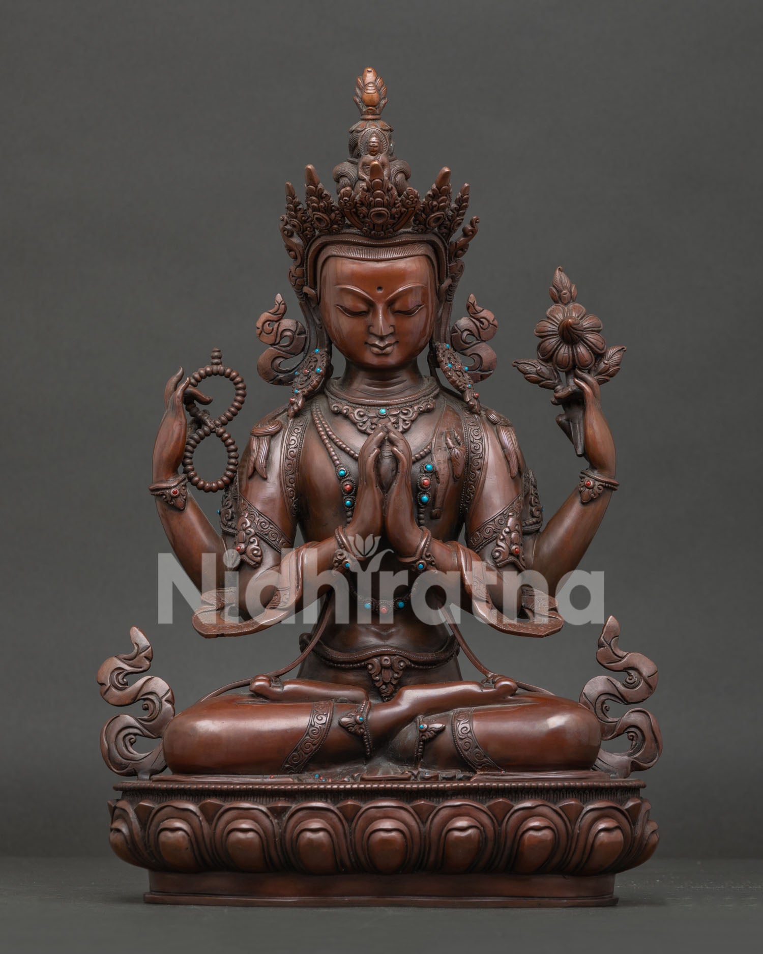 Handcrafted Chenrezig statue with oxidized copper finish and semi precious stone details
