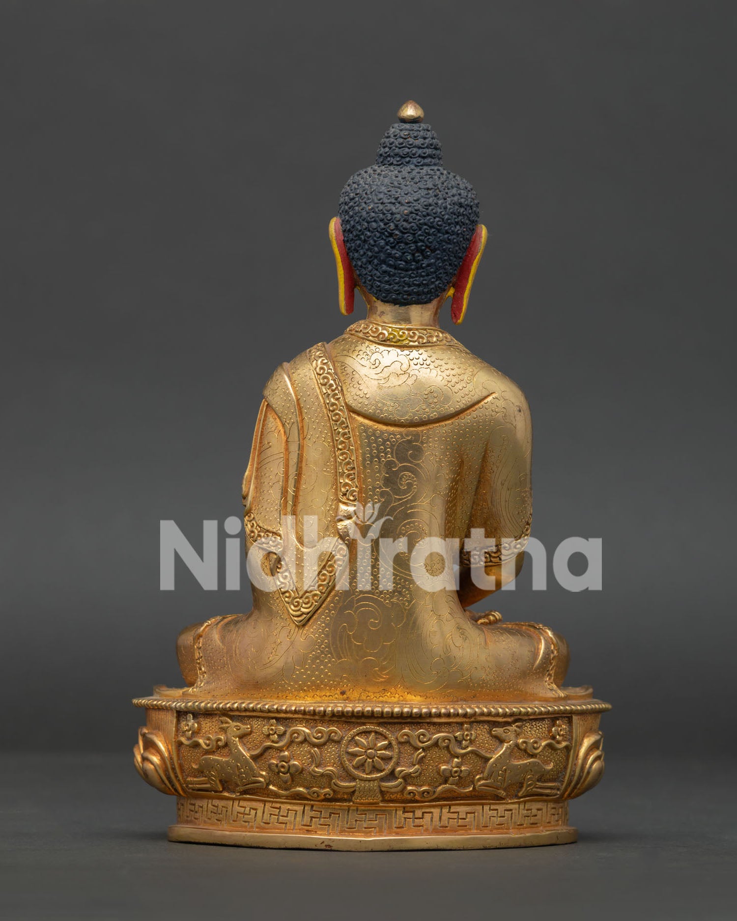 Handcrafted copper Amitabha Buddha statue with Dharma Wheel and deer engraved pedestal.