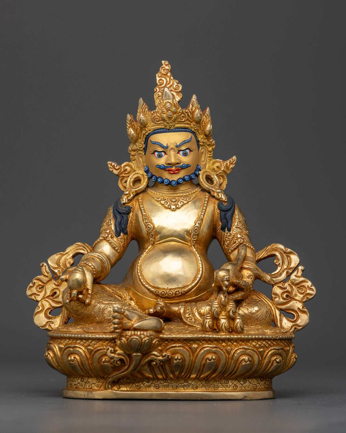 Handcrafted Dzambhala Buddhist wealth deity statue from Patan, Nepal with intricate carvings