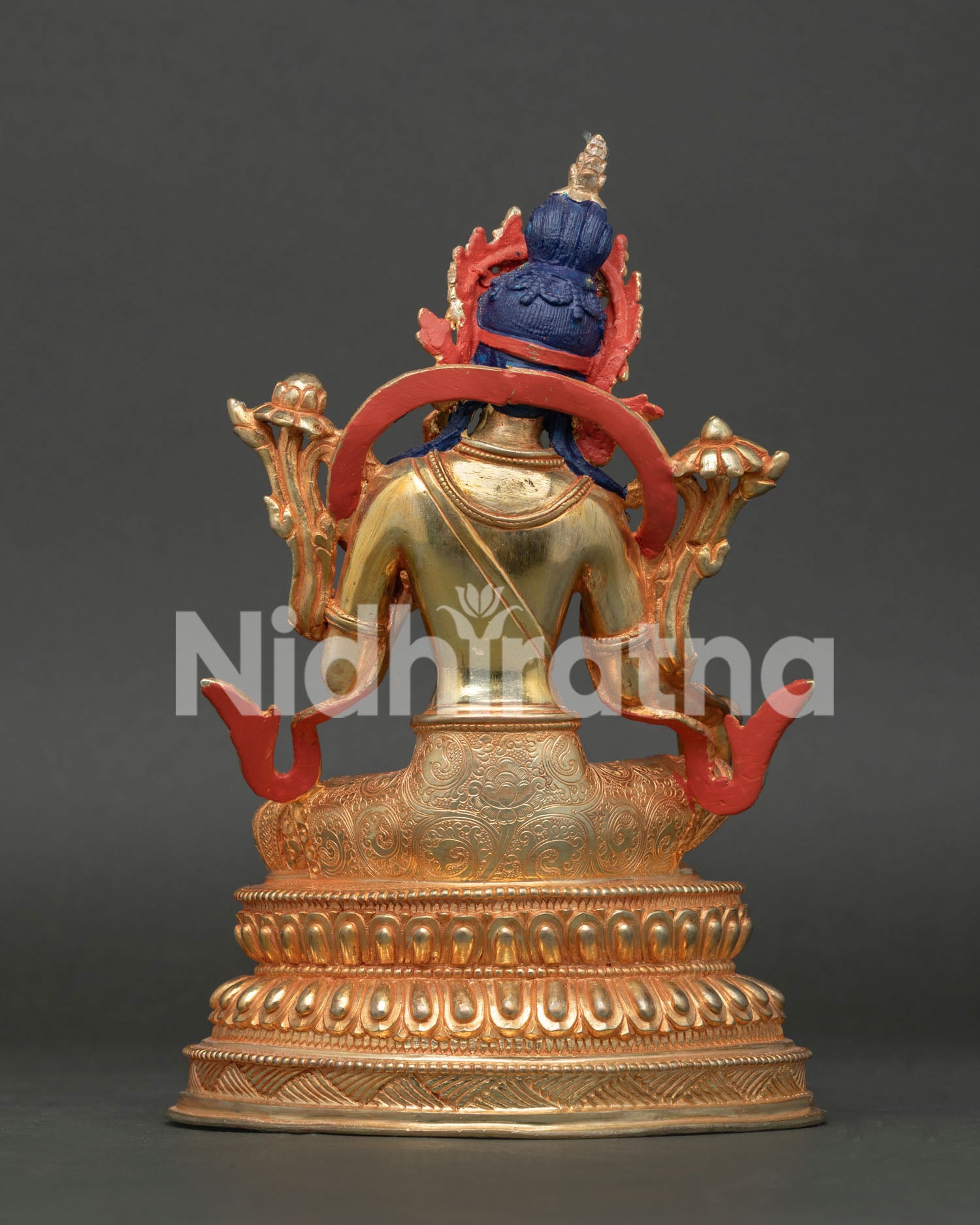Handcrafted Green Tara Buddhist statue back view with gold gilding and detailed Nepalese craftsmanship.