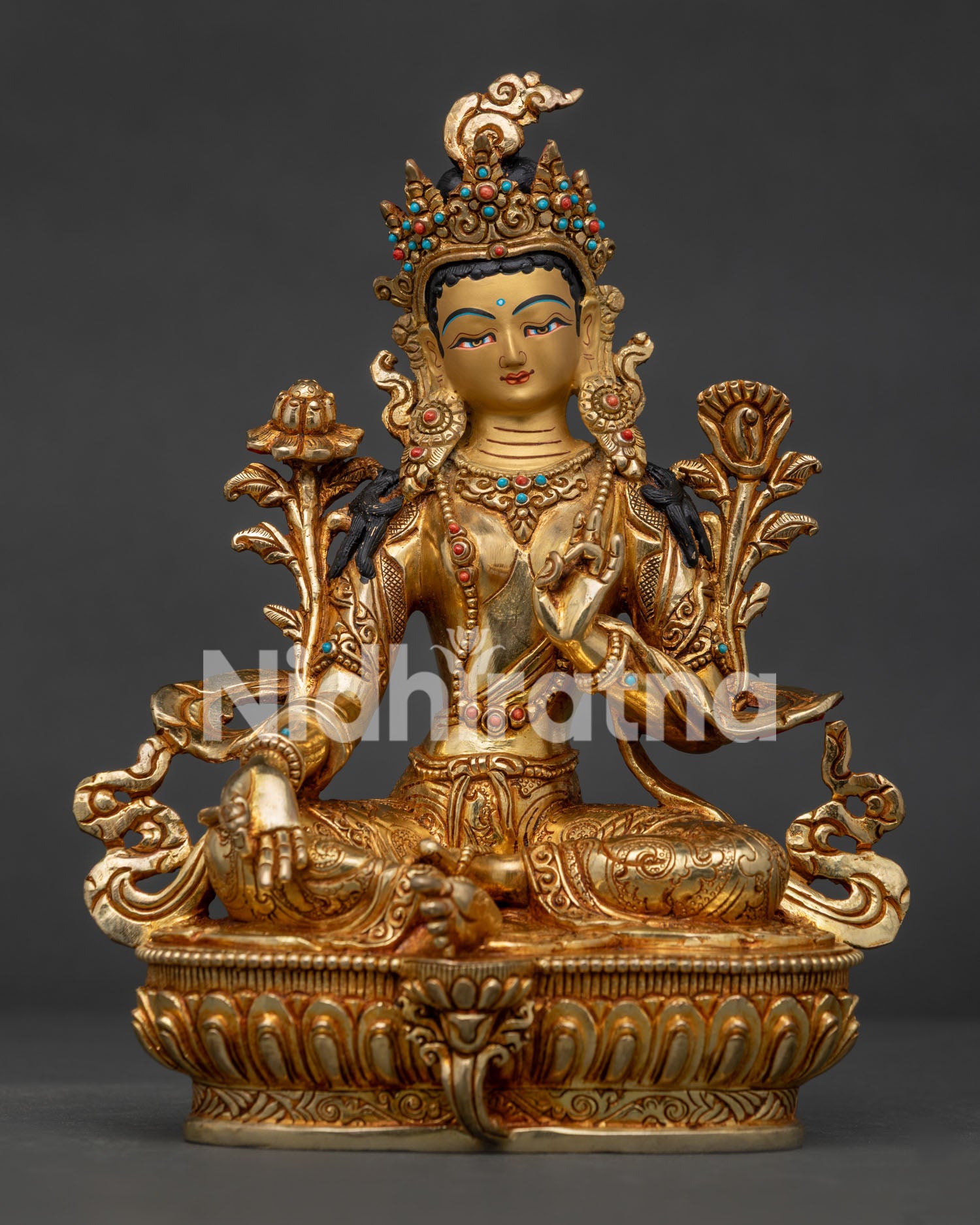 Handcrafted Green Tara statue from Patan, Nepal with gold gilding floral motifs and lotus pedestal