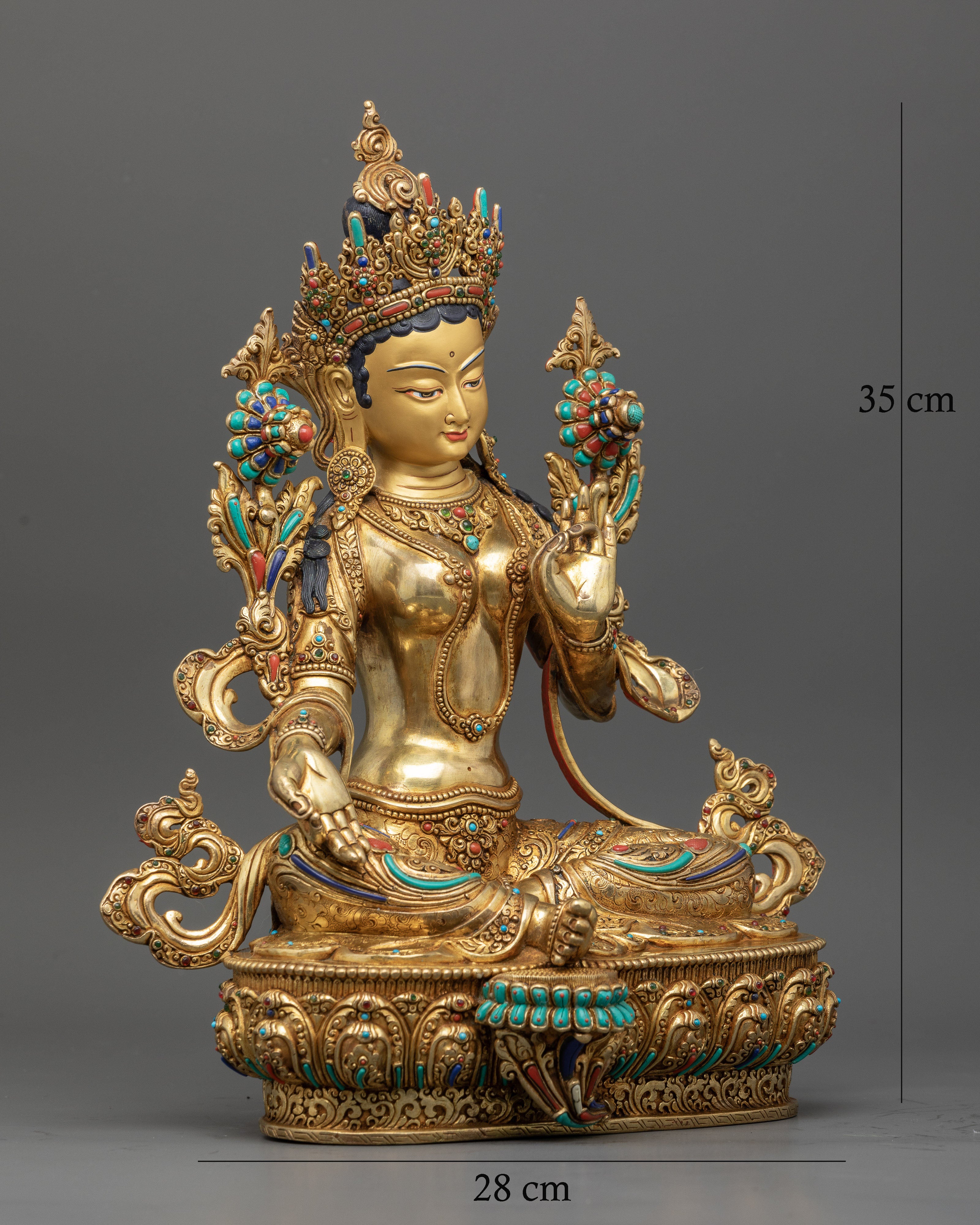 Handcrafted Green Tara statue in Lalitasana pose with blooming Utpala lotus.