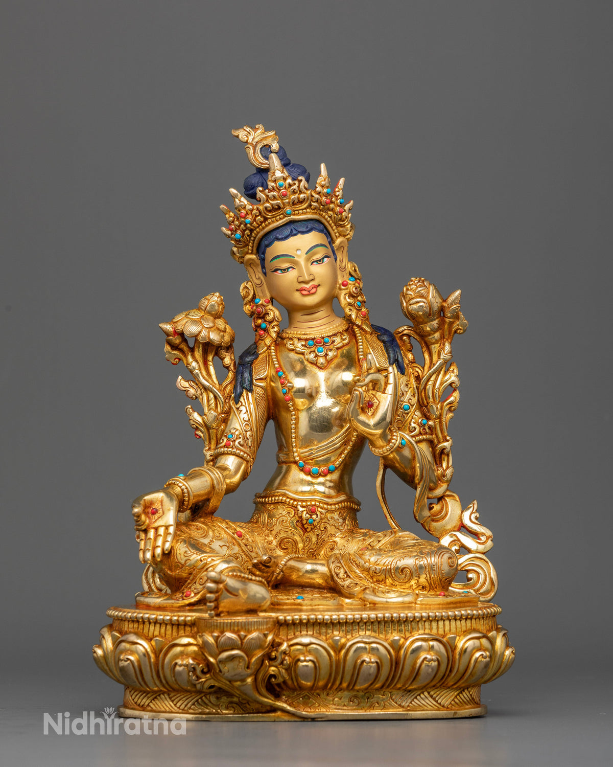 Handcrafted Green Tara statue made from copper with 24K gold fire gilding by Newari artisans in Patan, Nepal.
