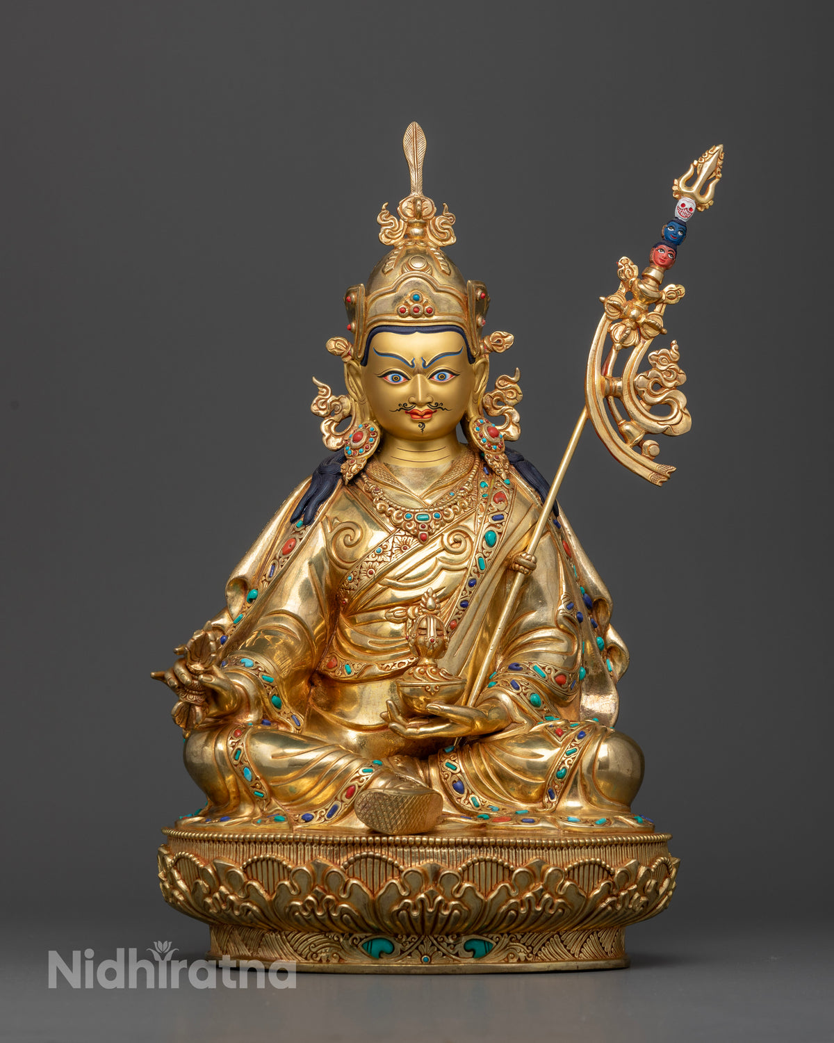 Handcrafted Guru Padmasambhava sculpture wearing a red lotus hat with vulture feather