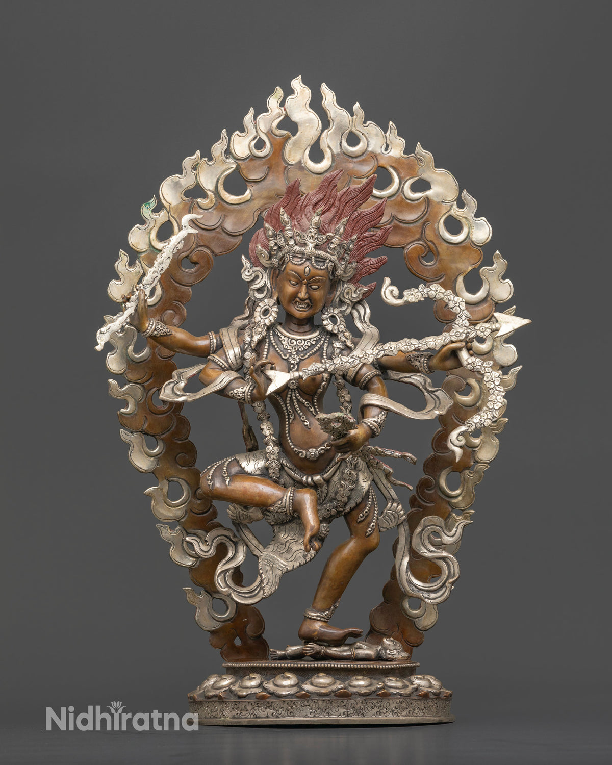 Handcrafted Kurukulla statue made from copper with a chemically oxidized finish and silver plated halo by a Newari artist from Patan Nepal.