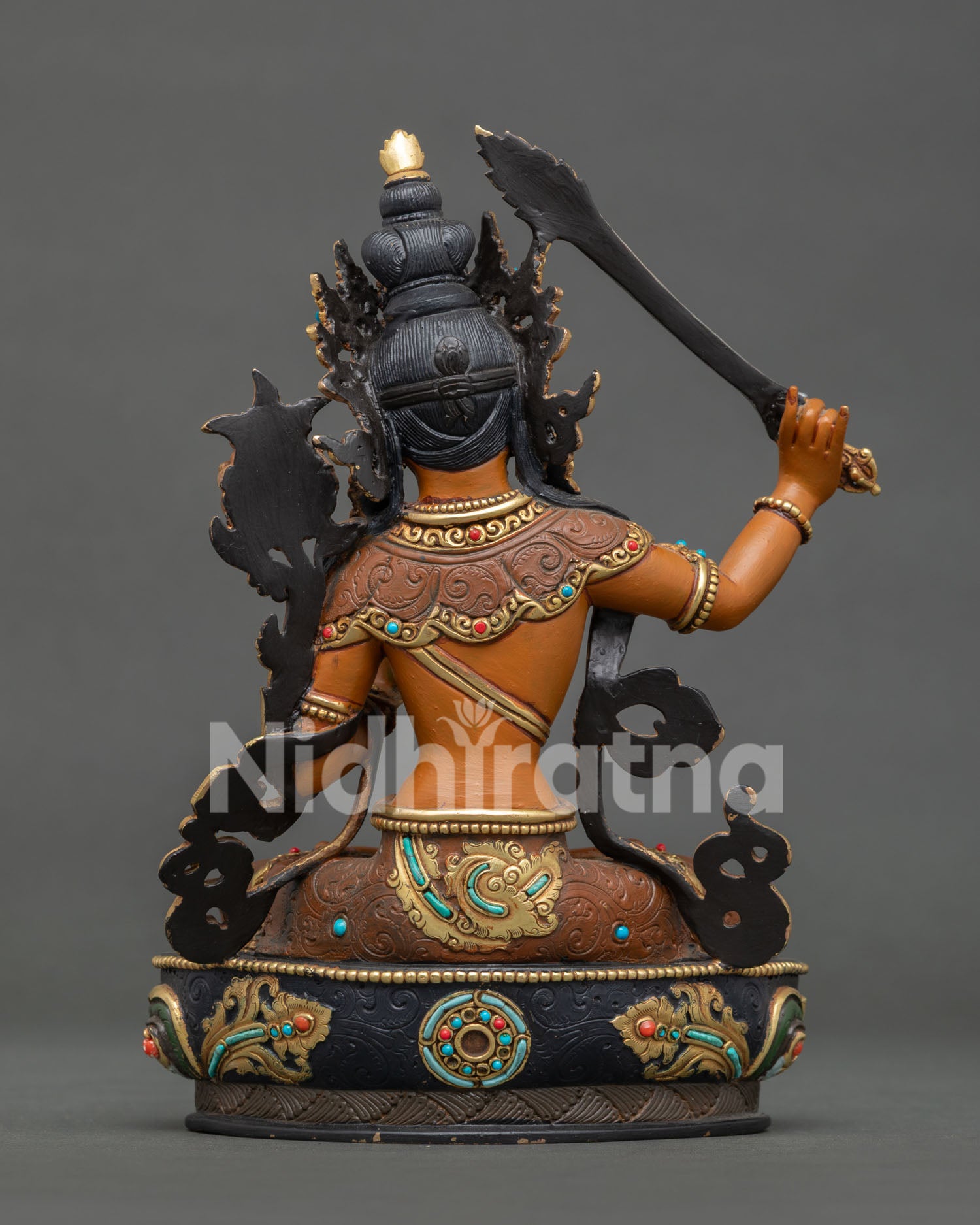 Handcrafted Manjushri Bodhisattva statue from Nepal with gold gilded details and gemstones