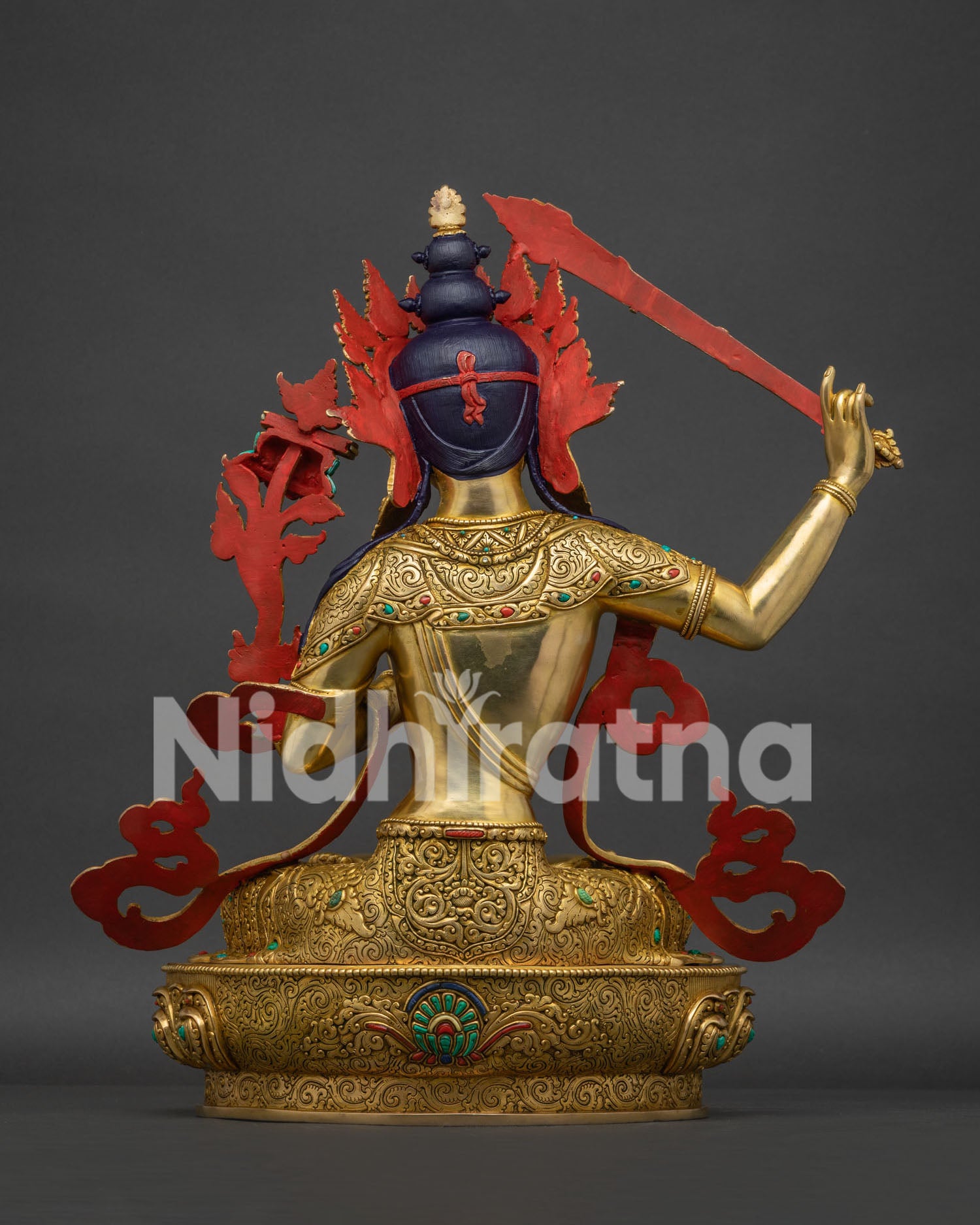 handcrafted Manjushri statue from Nepal gold fire gilded back view
