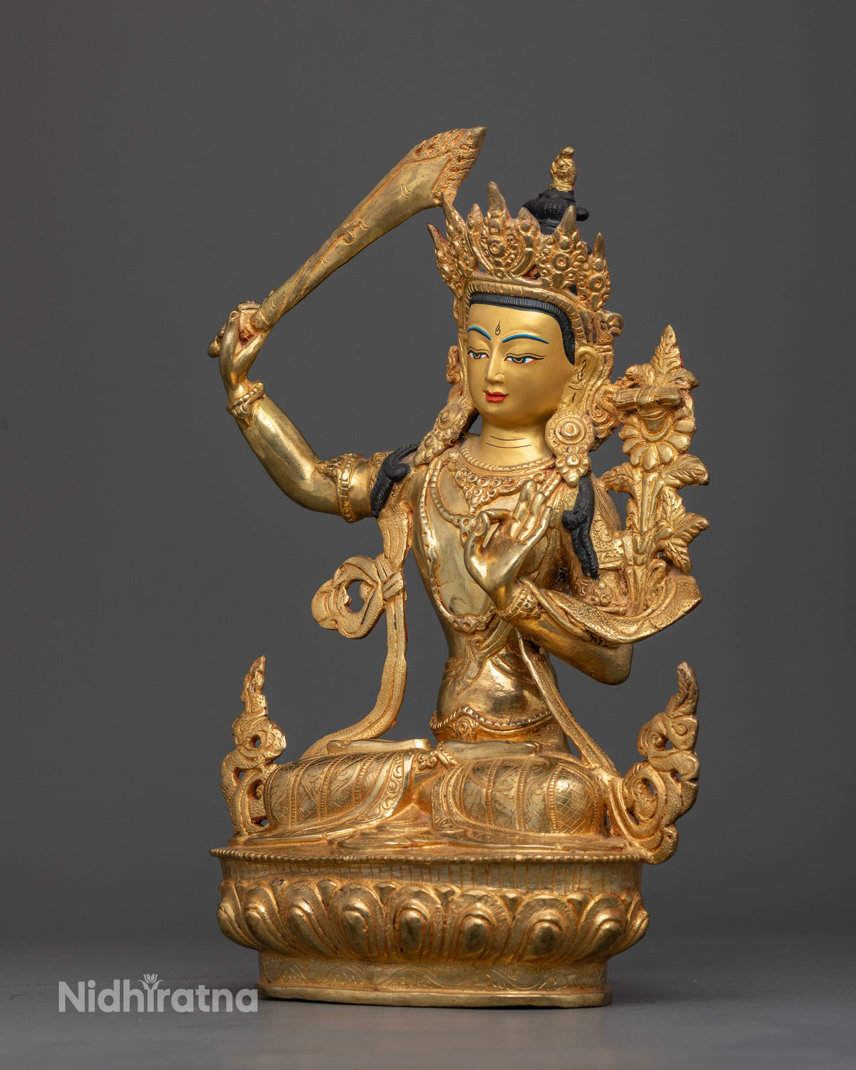 Handcrafted Manjushri Statue from Nepal with 24K gold painted face.