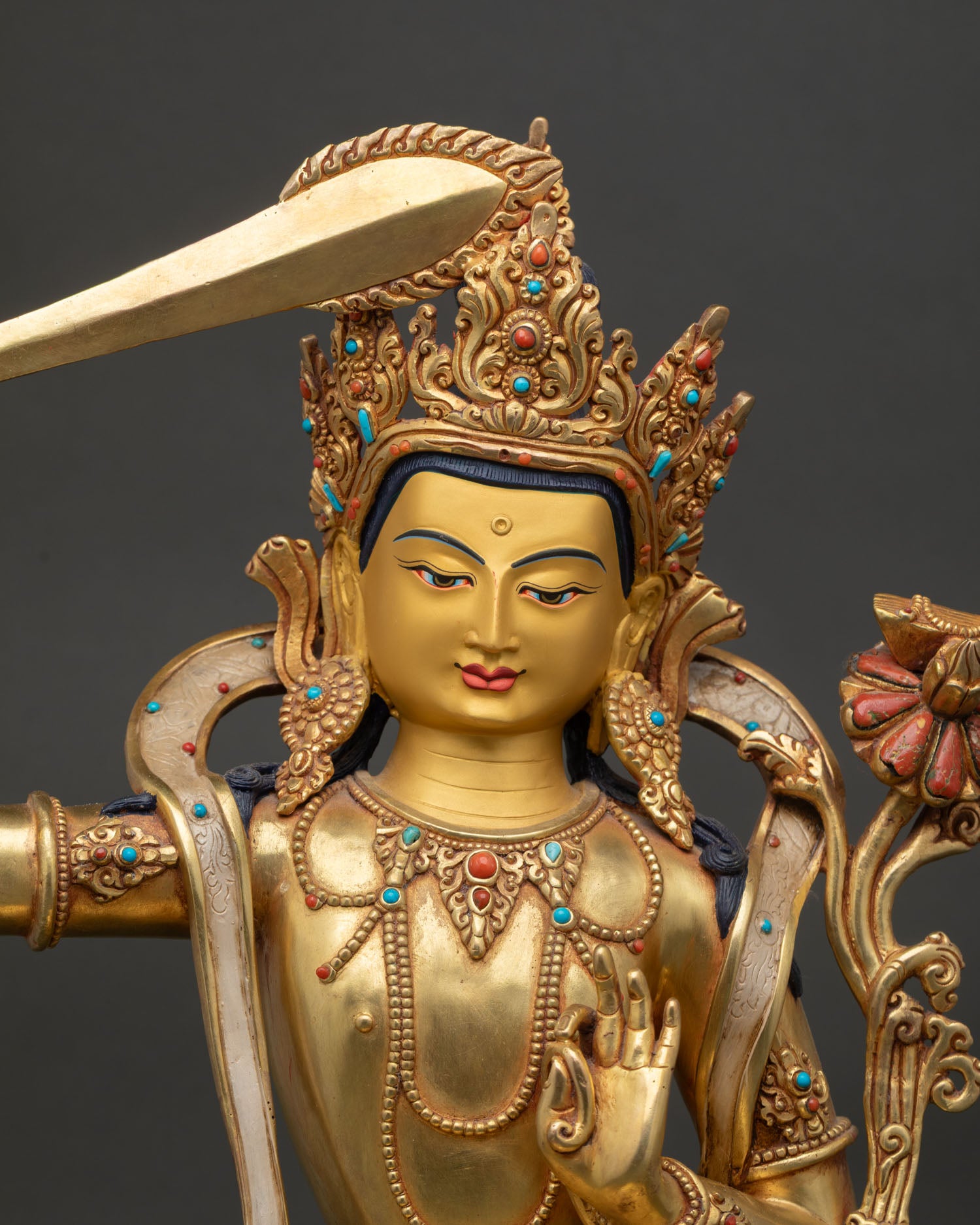 Handcrafted Manjushri Statue with ornate crown and gold fire-gilded details close-up