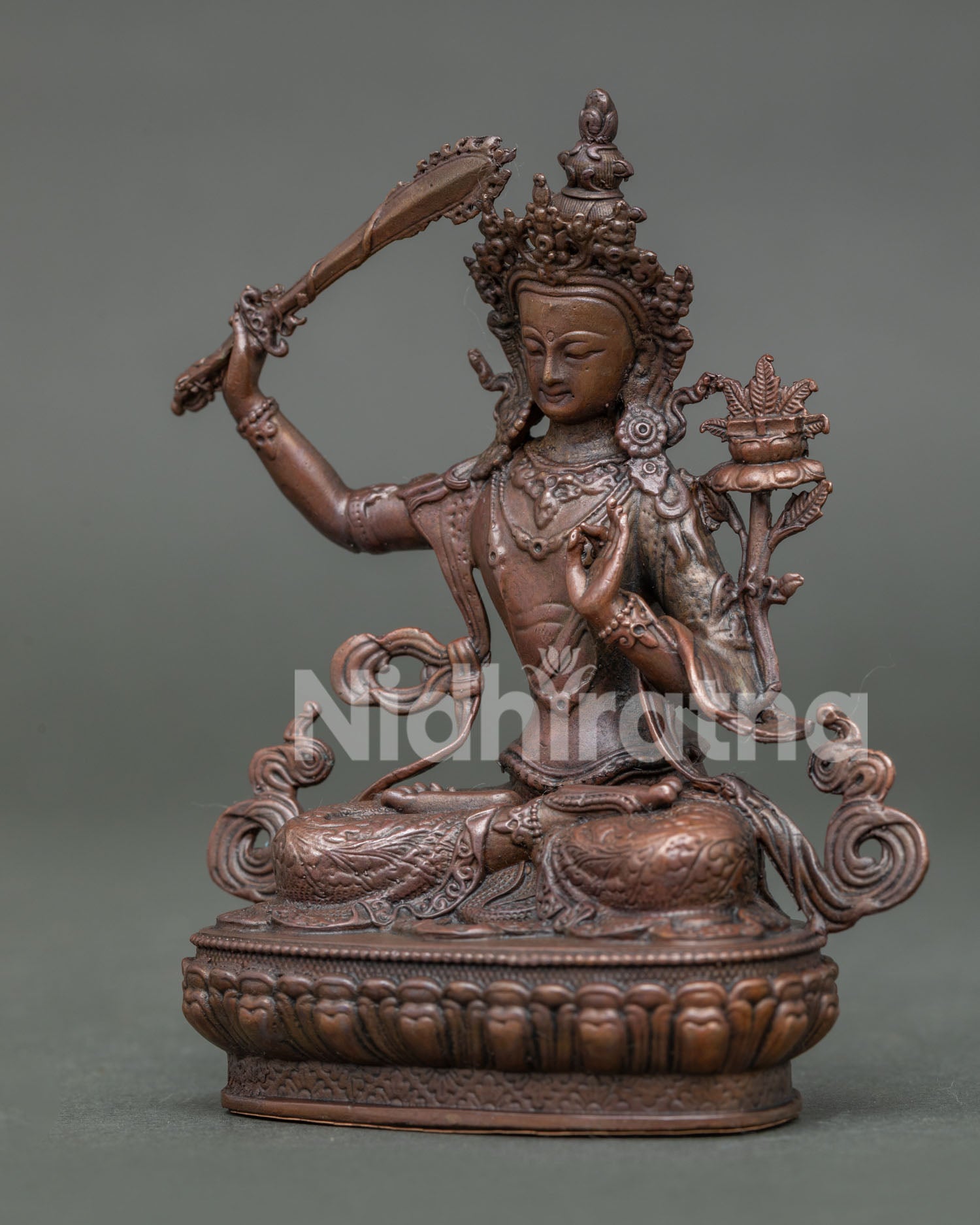 Handcrafted manjushri statue with oxidized copper finish from patan nepal.