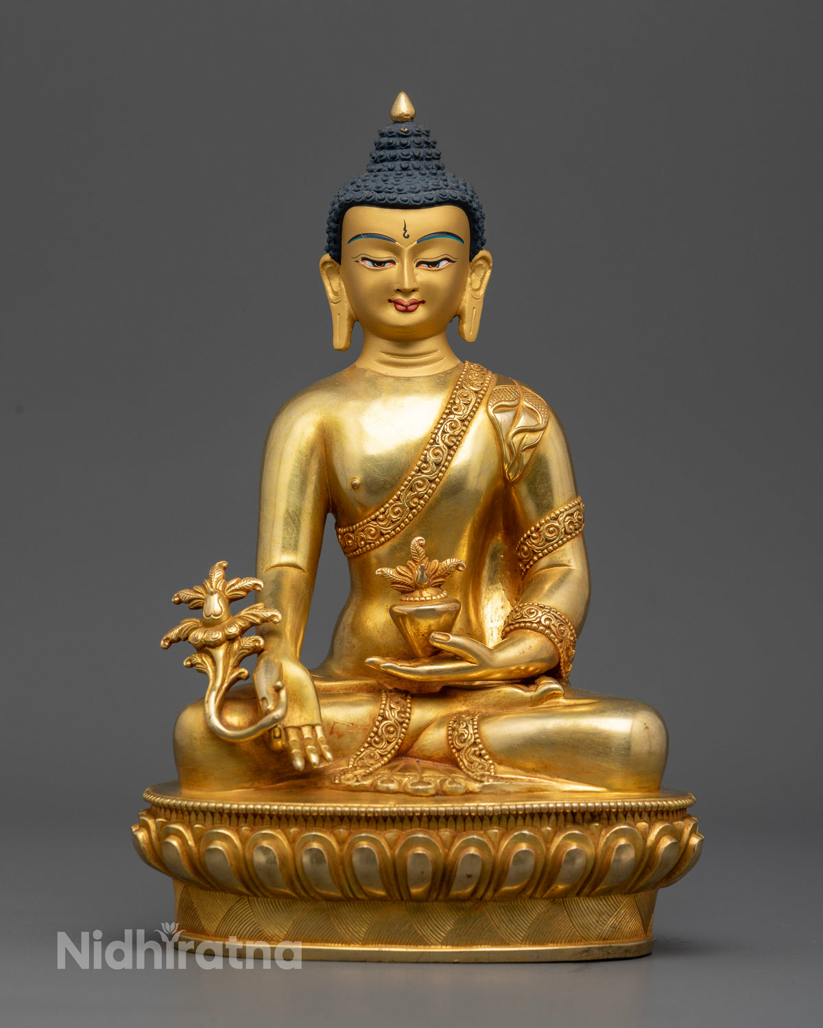Handcrafted medicine buddha statue in gold gilded copper from patan nepal.