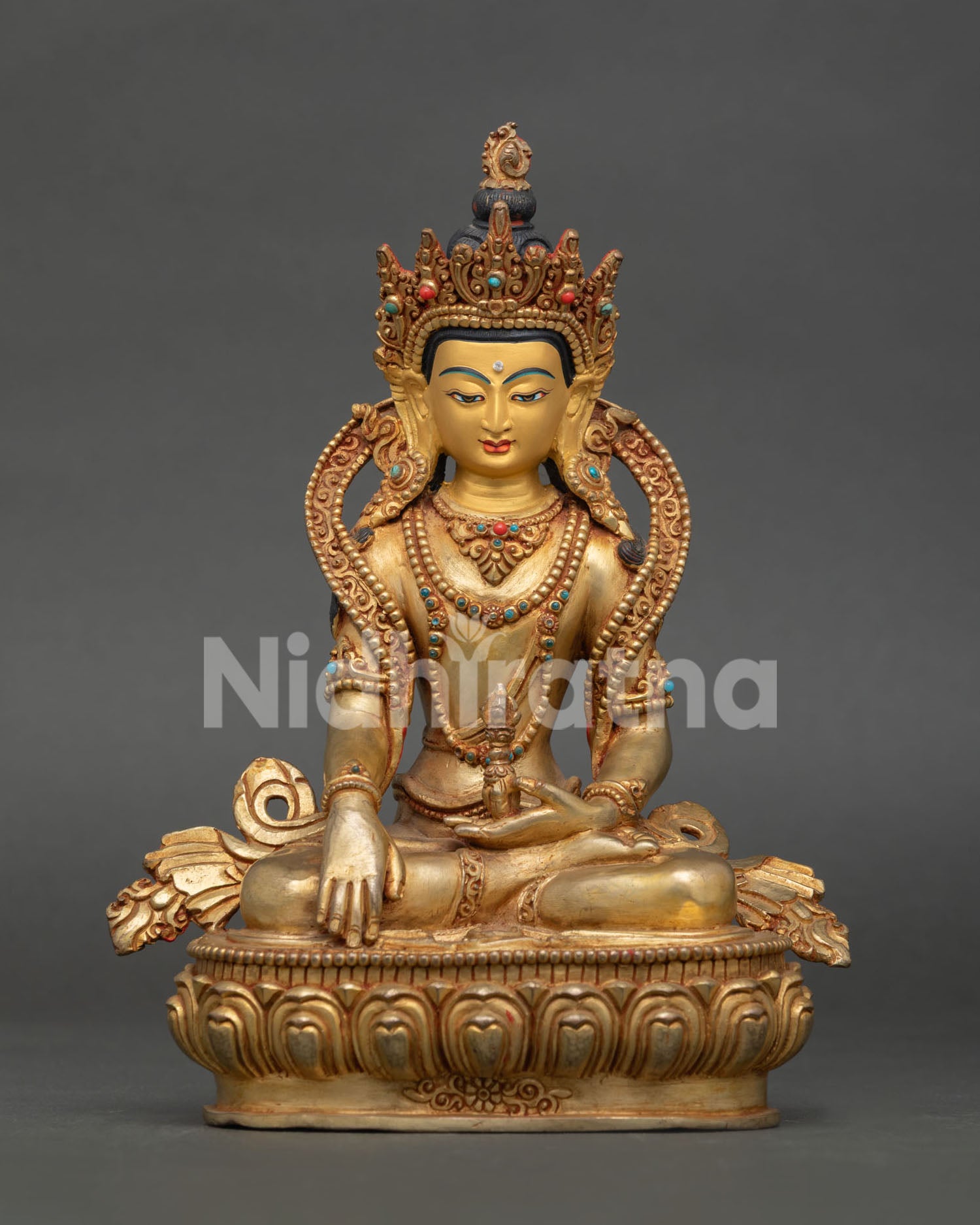 Handcrafted Mitrugpa Buddha Statue with gold fire gilding, gold painted face, and Bhumisparsa Mudra, made in Nepal.