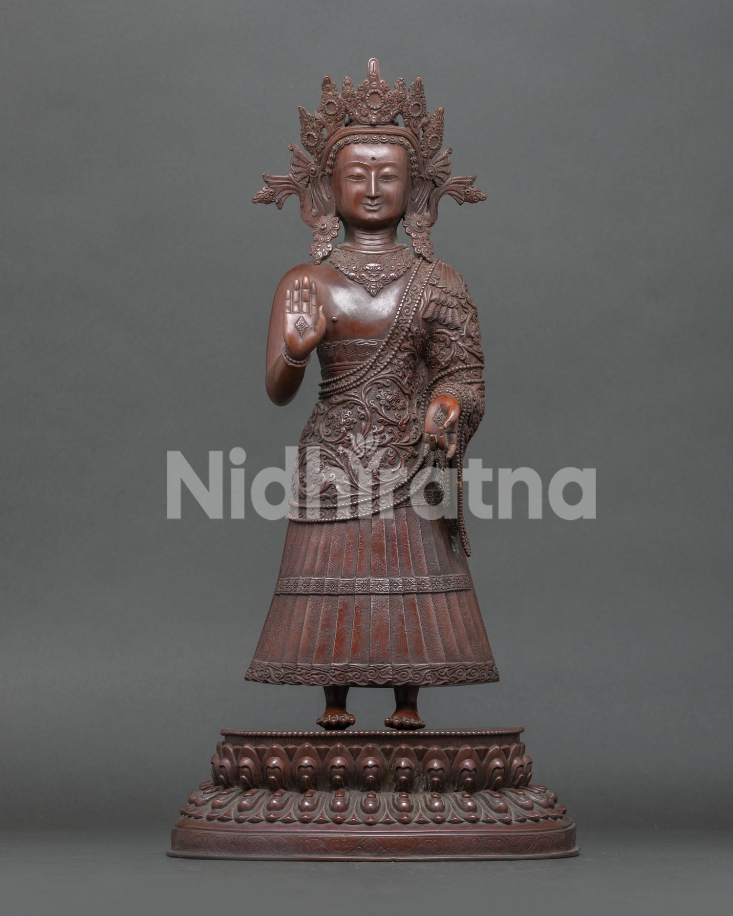 Handcrafted oxidized Dipankara Buddha Statue, made in Patan, Nepal with a copper body, standing on a double lotus throne.