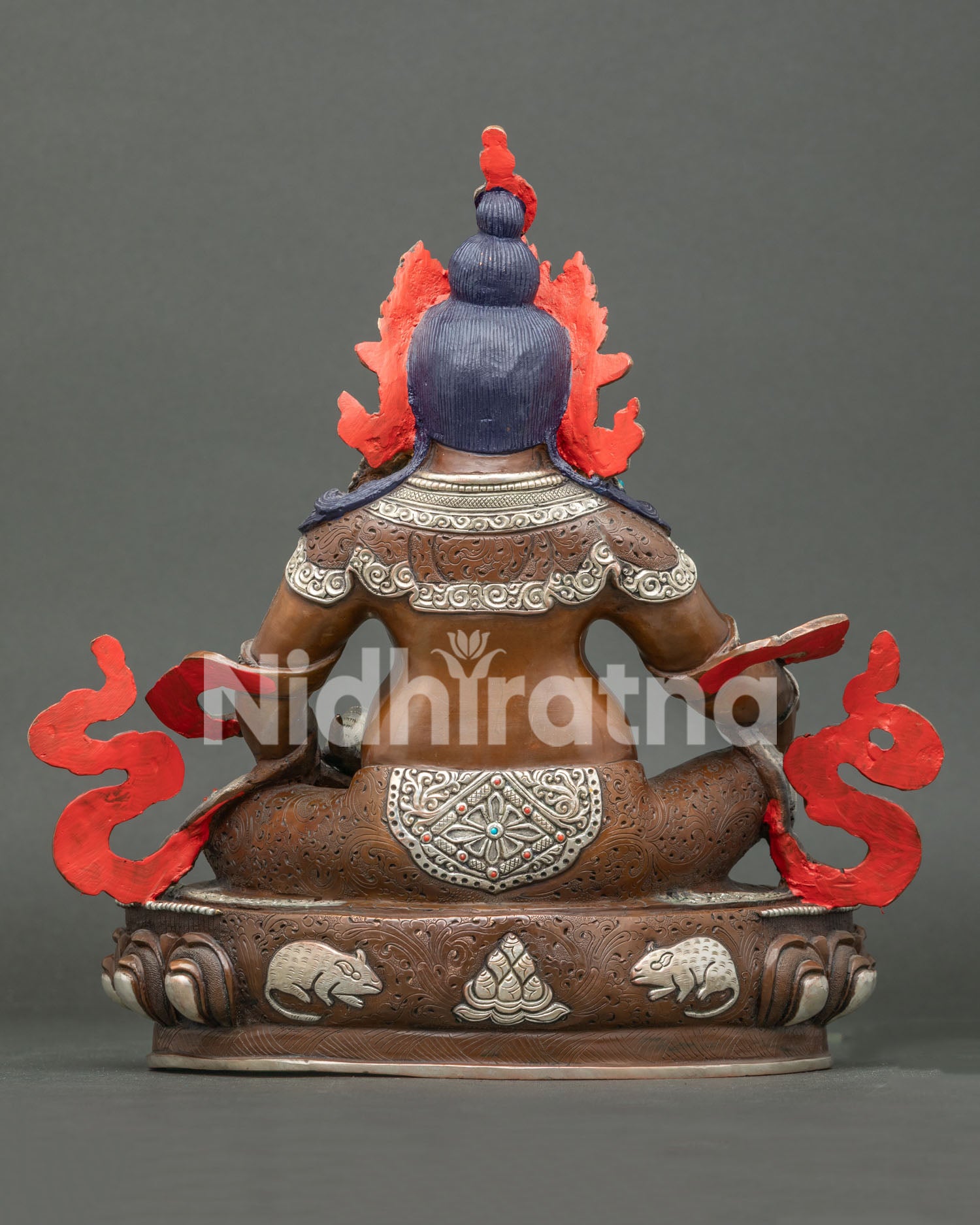 Handcrafted Oxidized Jambhala statue back view showing engraved lotus base with mongoose and jewel details