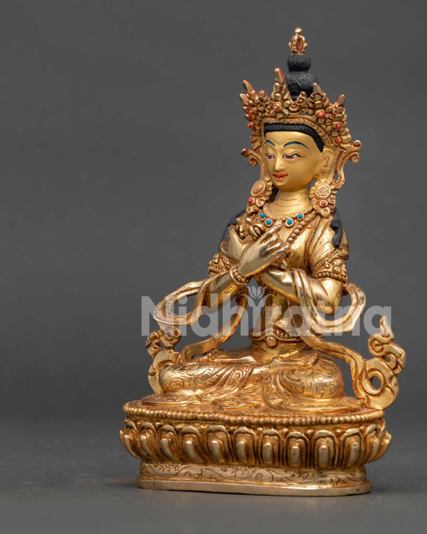 Handcrafted Vajradhara Statue in gold gilded copper with turquoise coral stones from Nepal.