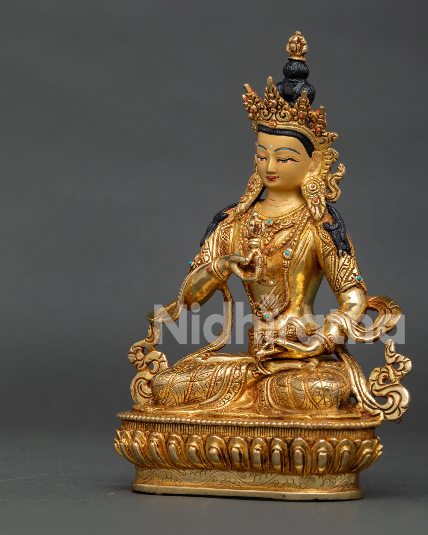 Handcrafted Vajrasattva Statue in gold gilded copper with semi precious stones from Nepal.