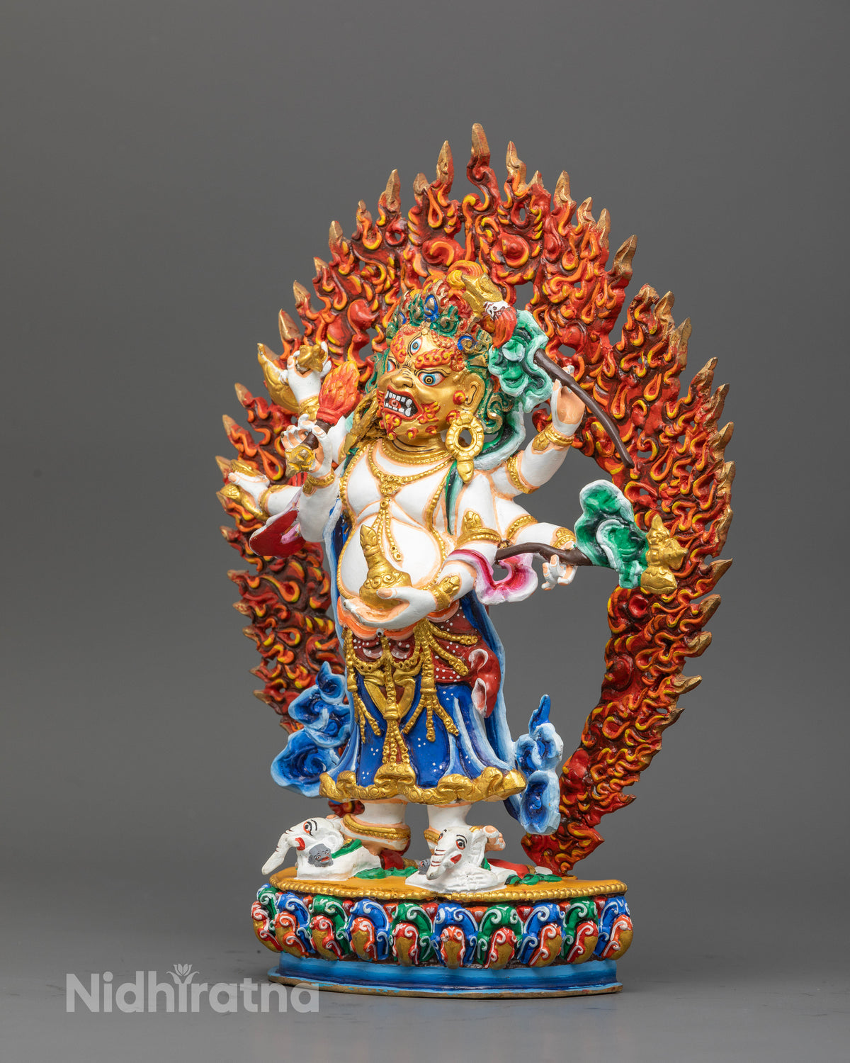 Handcrafted White Mahakala statue with gold gilded details on multicolor lotus.