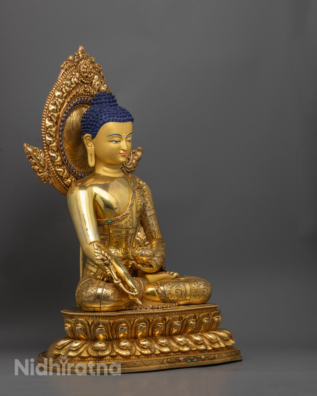 handcrafted 24K gold-gilded Medicine Buddha statue seated in meditation on a lotus base – symbol of healing and inner peace.