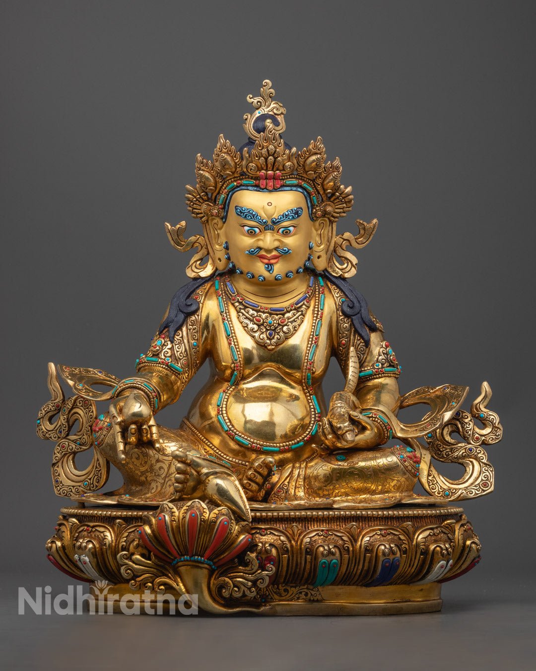 handcrafted Dzambhala statue with a 24K gold-coated face, semi-precious stones, and vibrant acrylic detailing, symbolizing wealth and prosperity.