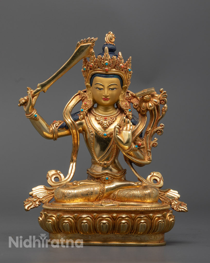 handcrafted Manjushri statue in 24K gold gilded copper, showcasing his sword of wisdom and sacred lotus with scripture.