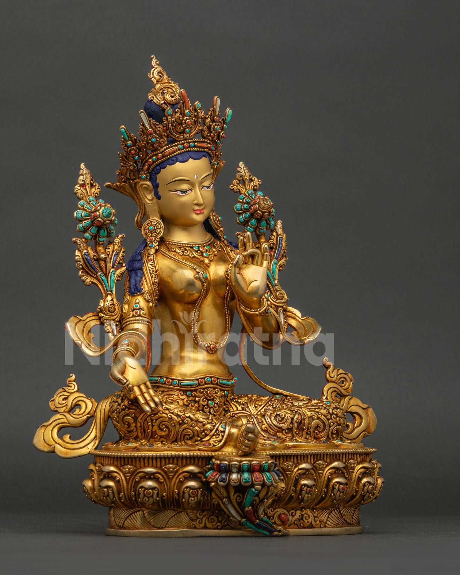 Handmade Green Tara Buddhist statue from Nepal showing detailed craftsmanship, right side view