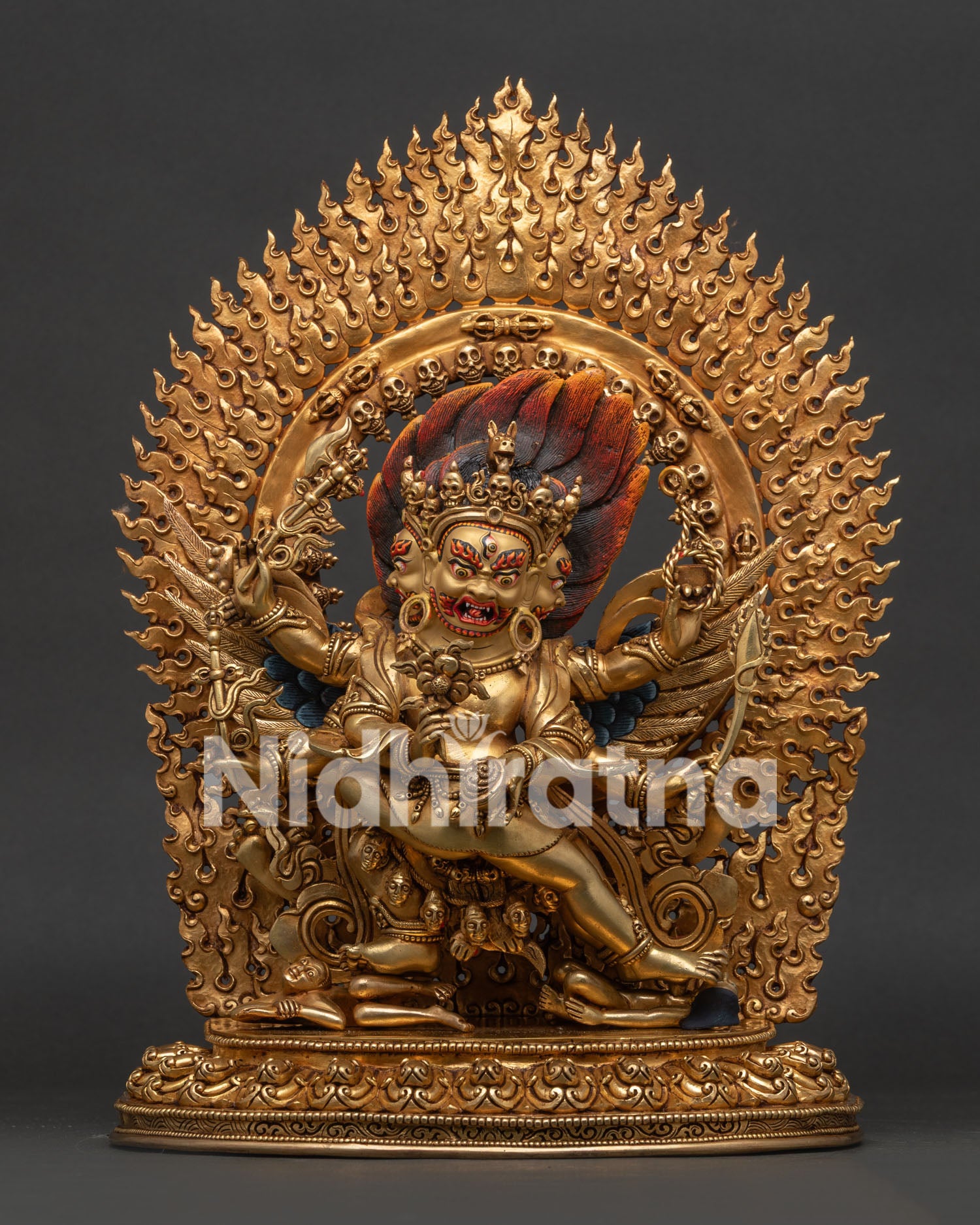 Hayagriva deity statue wrathful face detail with gold painted features close up