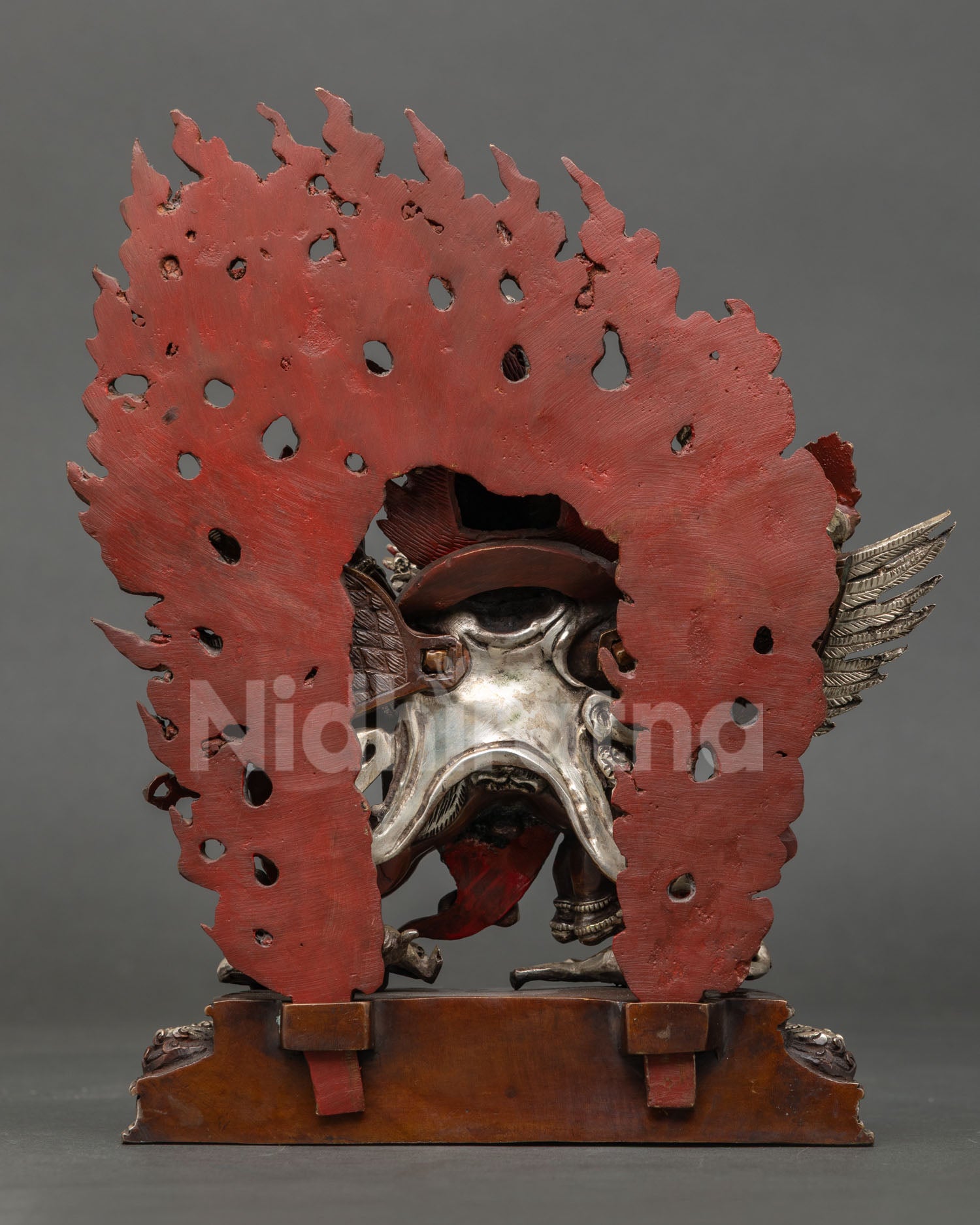 Hayagriva statue back view, hand-carved feathered wings, oxidized copper, silver accents, Newari
