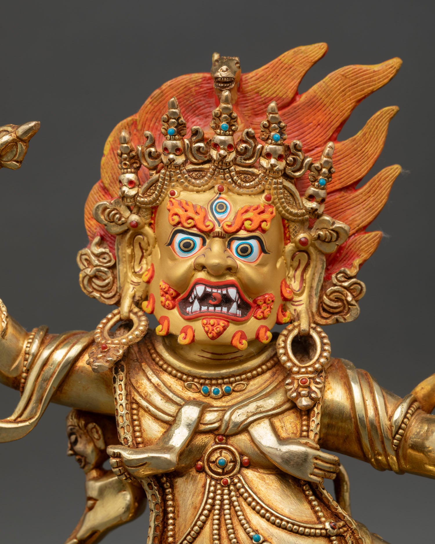 Hayagriva statue close up fierce gold painted face semi precious stones detail wrathful deity for spiritual protection art