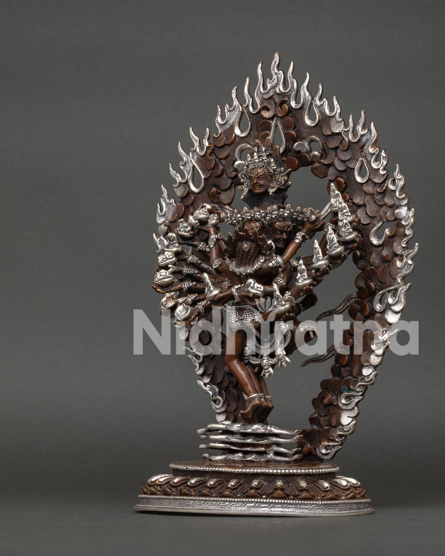Hevajra Buddhist statue standing with consort Nairatmya on lotus pedestal detailed view.