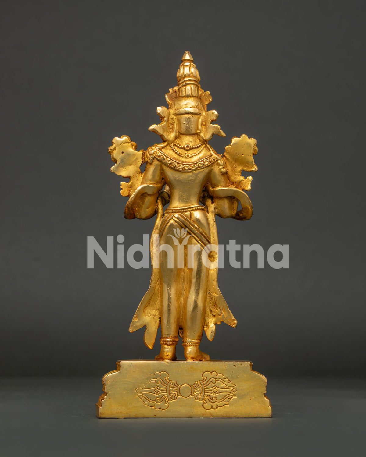 Himalayan Buddhist statue featuring lapis lazuli body gold gilding and coral embellishments