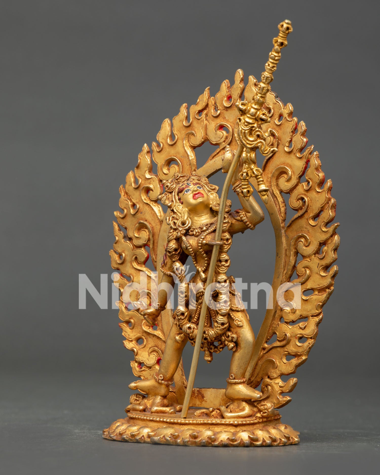 Himalayan Vajrayogini sculpture with blazing flame halo and sacred Buddhist symbolism.