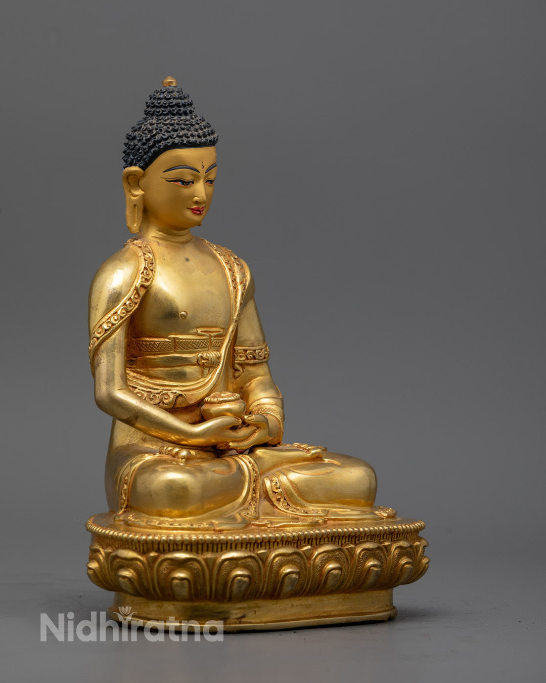 Sacred hollow chamber at base of Amitabha Buddha statue for storing mantras or relics, following Pure Land Buddhist consecration traditions