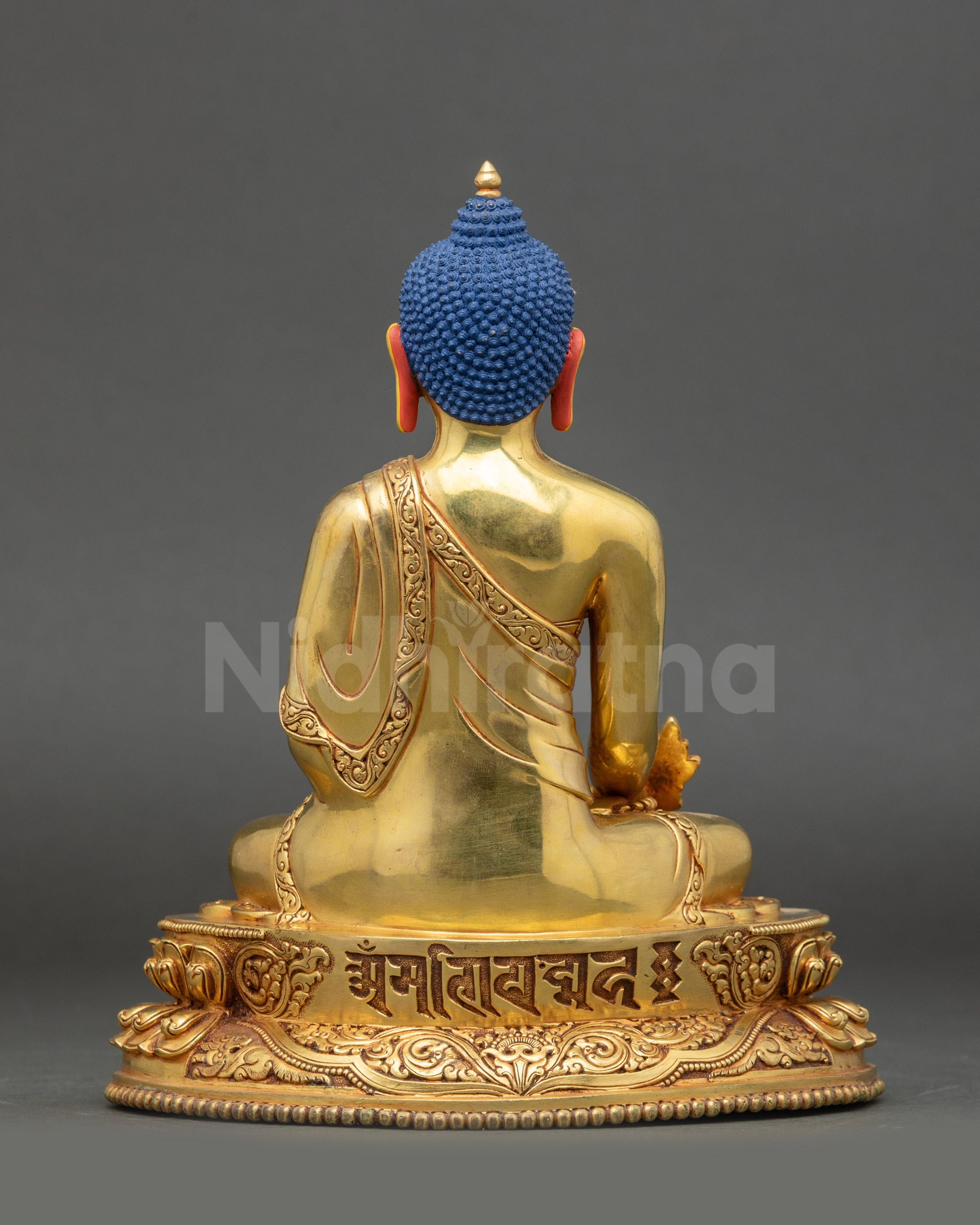 Back of Nepalese Medicine Buddha engraved with Tibetan Om Bodhi Svāhā script