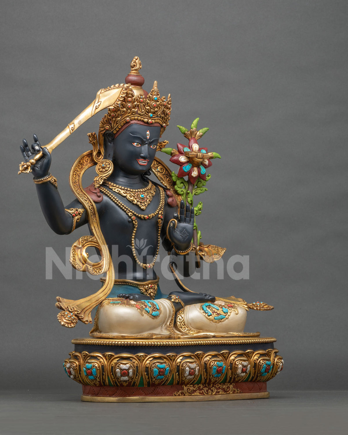 Jampal Nagpo statue angled view, hand-painted Black Manjushri with gold gilded crown and jewelry