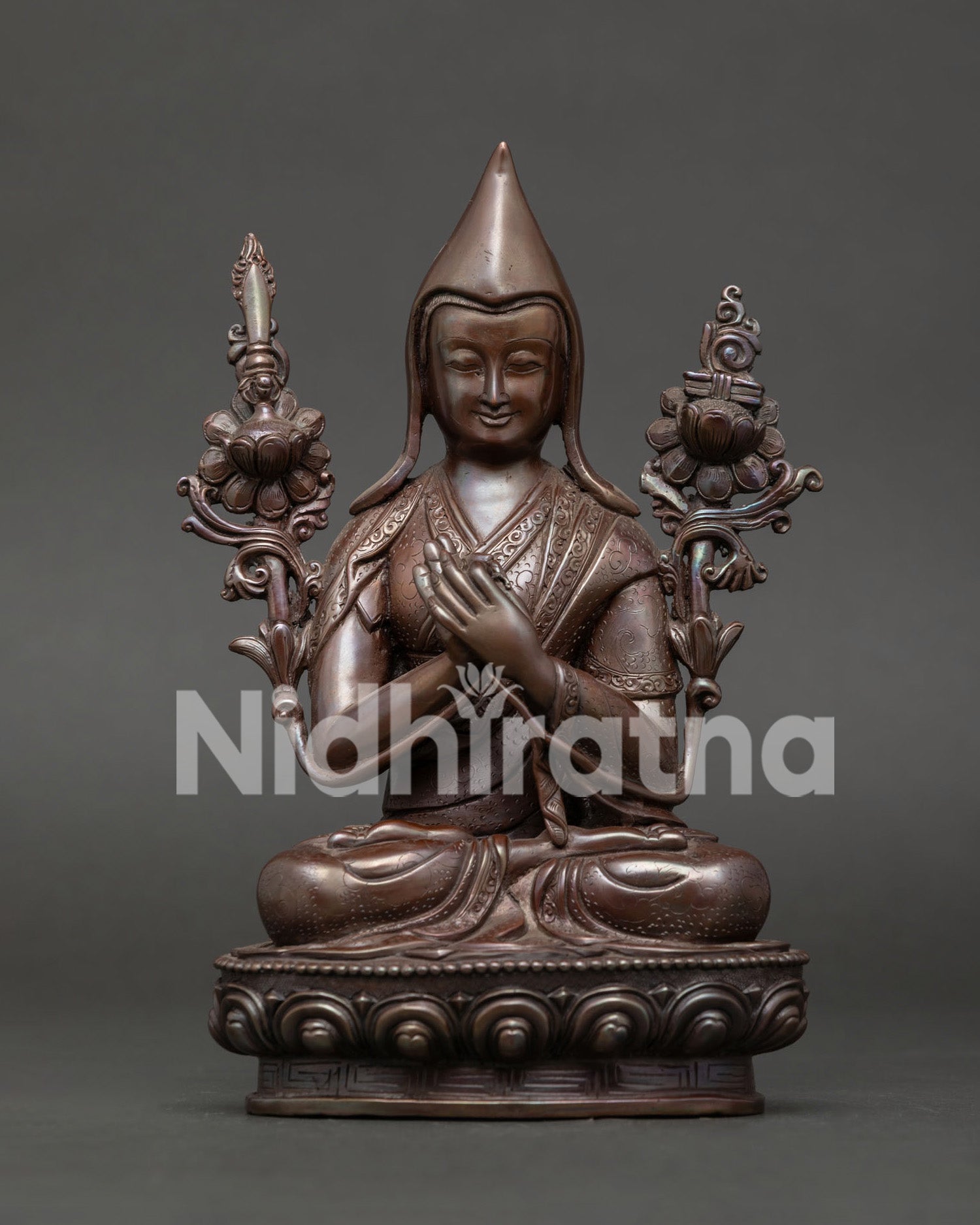 Je Tsongkhapa statue front view oxidized copper founder of the Gelug Tradition on lotus pedestal.