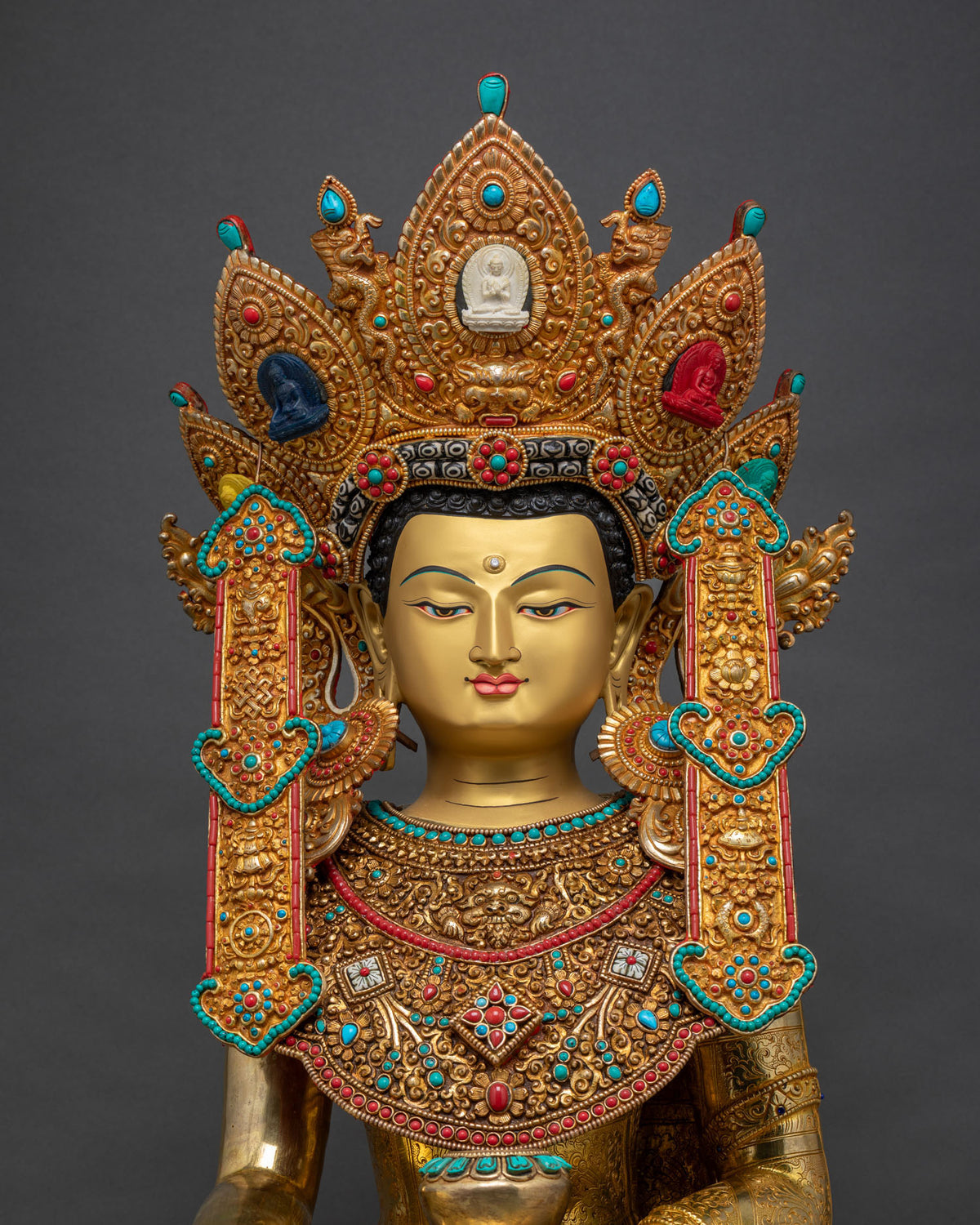 Jowo Rinpoche statue close up, gold crown with turquoise and coral gemstone details