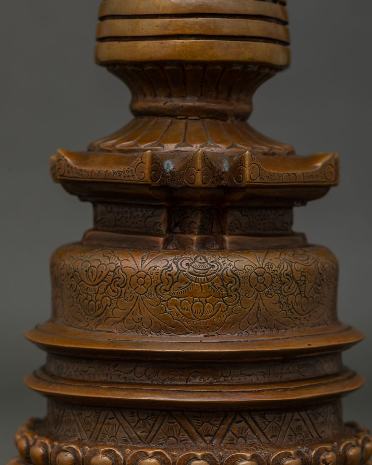 Kadampa Stupa with Eight Auspicious Symbols engraved on bell shaped base and double lotus pedestal.