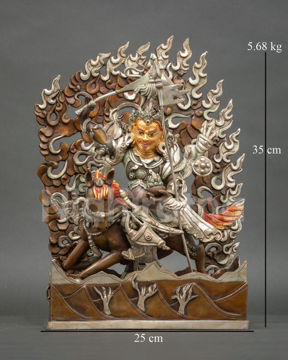 King Gesar statue mounted on horse with raised sword and victory banner.