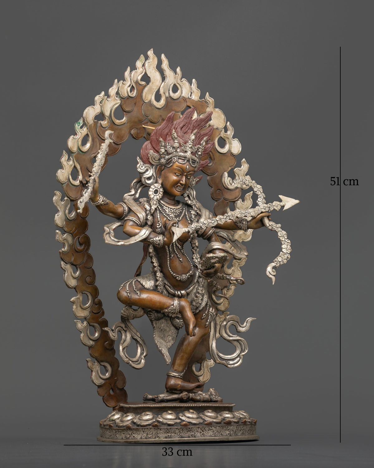 Kurukulla Buddhist statue featuring a silver plated halo intricate skull crown and ornate jewelry.