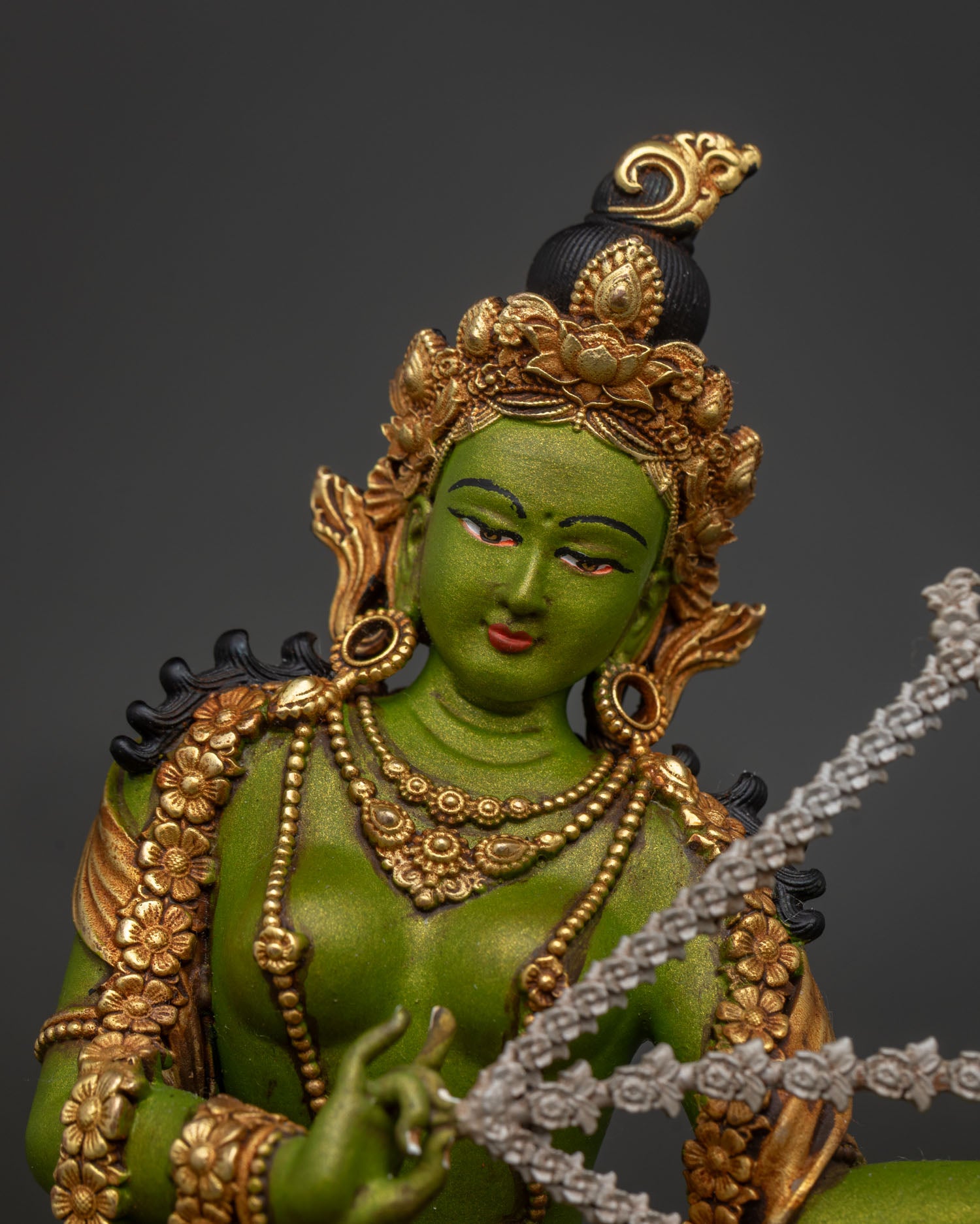 Kurukulla statue close-up – gold-gilded copper Buddhist Dakini craftsmanship detail