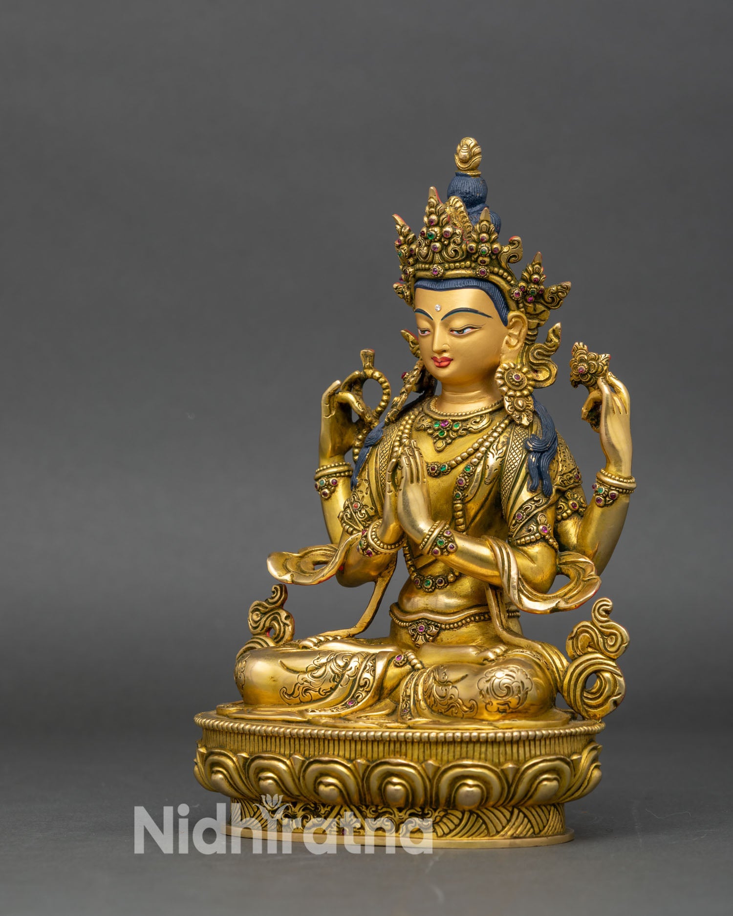 left profile chenrezig statue, copper and fire-gilded gold, traditional newar craftsmanship