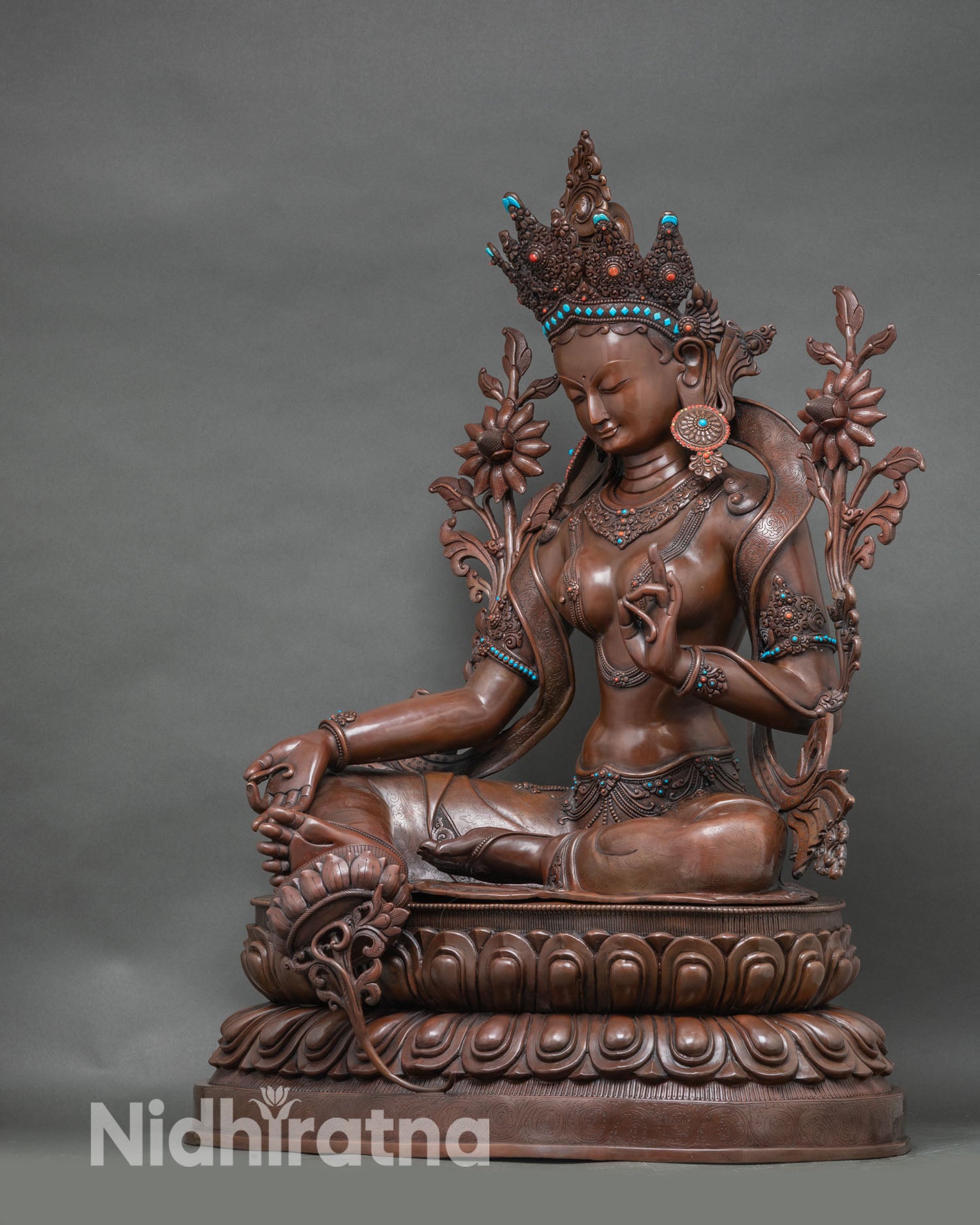 Left profile of Green Tara statue, grand copper sculpture with intricate Newari craftsmanship
