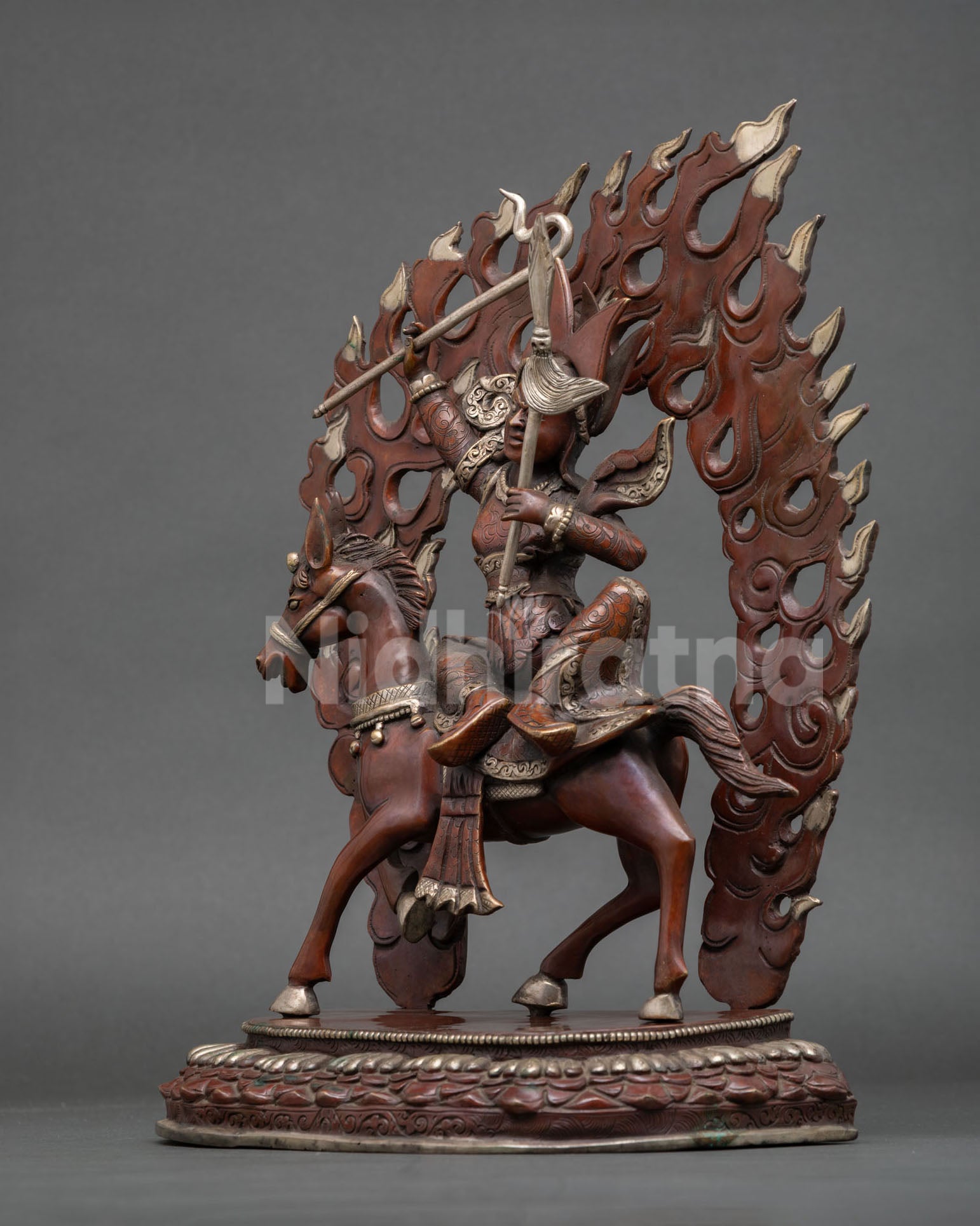 left profile of king gesar statue with victory banner and detailed copper artistry
