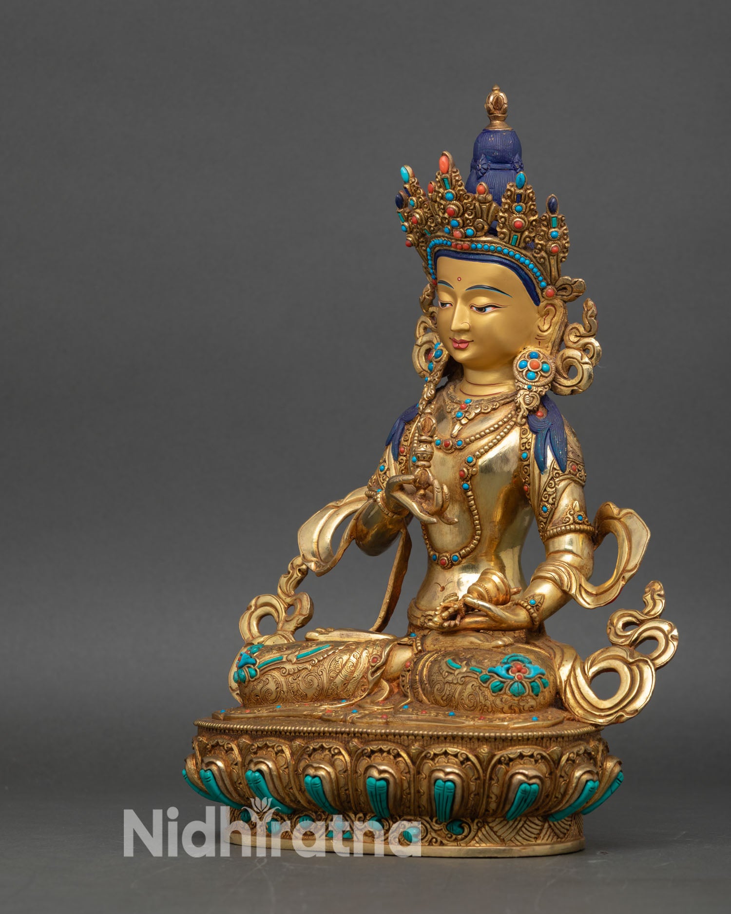 Left profile of Vajrasattva Dorje Sempa sculpture, handcrafted metalwork highlighting detailed ornamentation