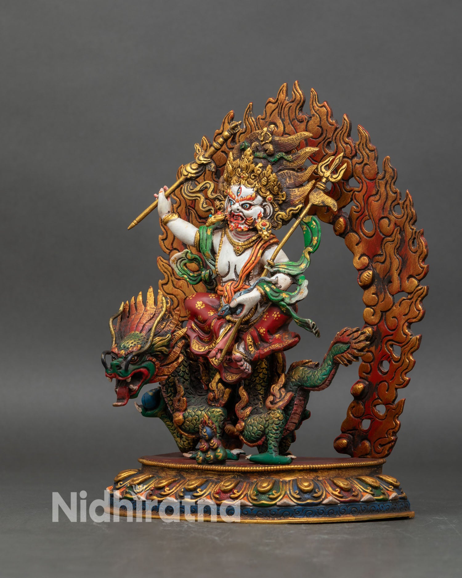 Left profile of White Dzambhala, copper and acrylic statue radiating prosperity