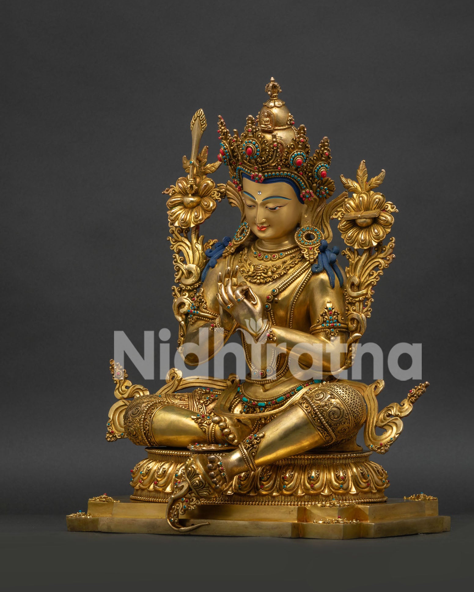Left side angle view of gold gilded Tikshna Manjushri statue from Nepal
