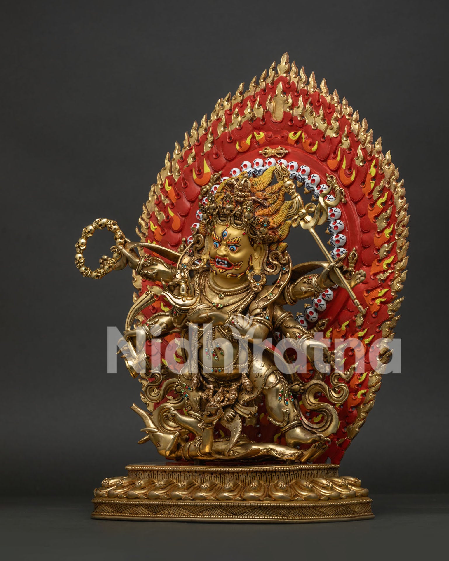 left side profile of shadbhuja mahakala statue on lotus throne
