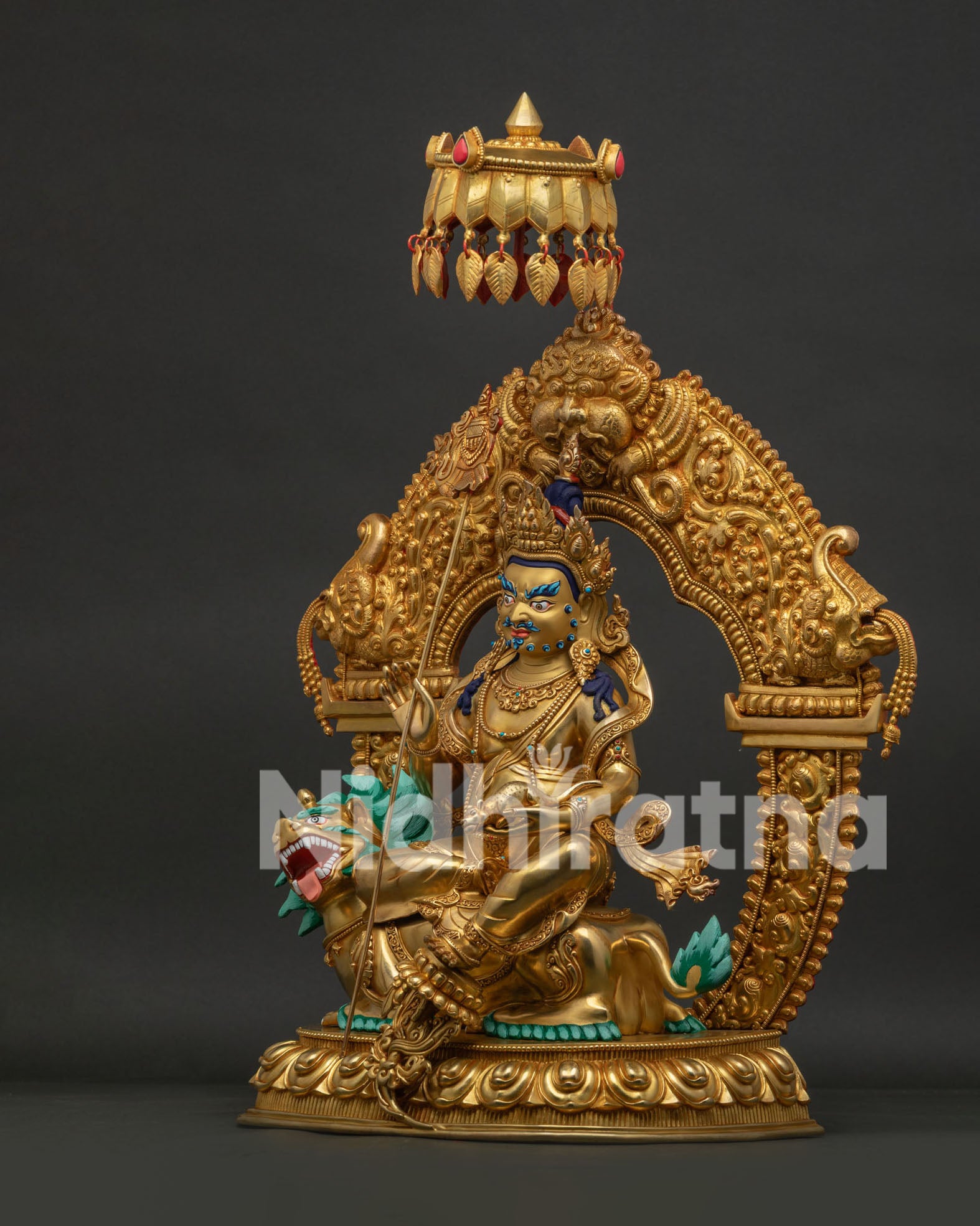 Left side profile of Vaisravana Namtoshe copper sculpture on elevated lotus throne